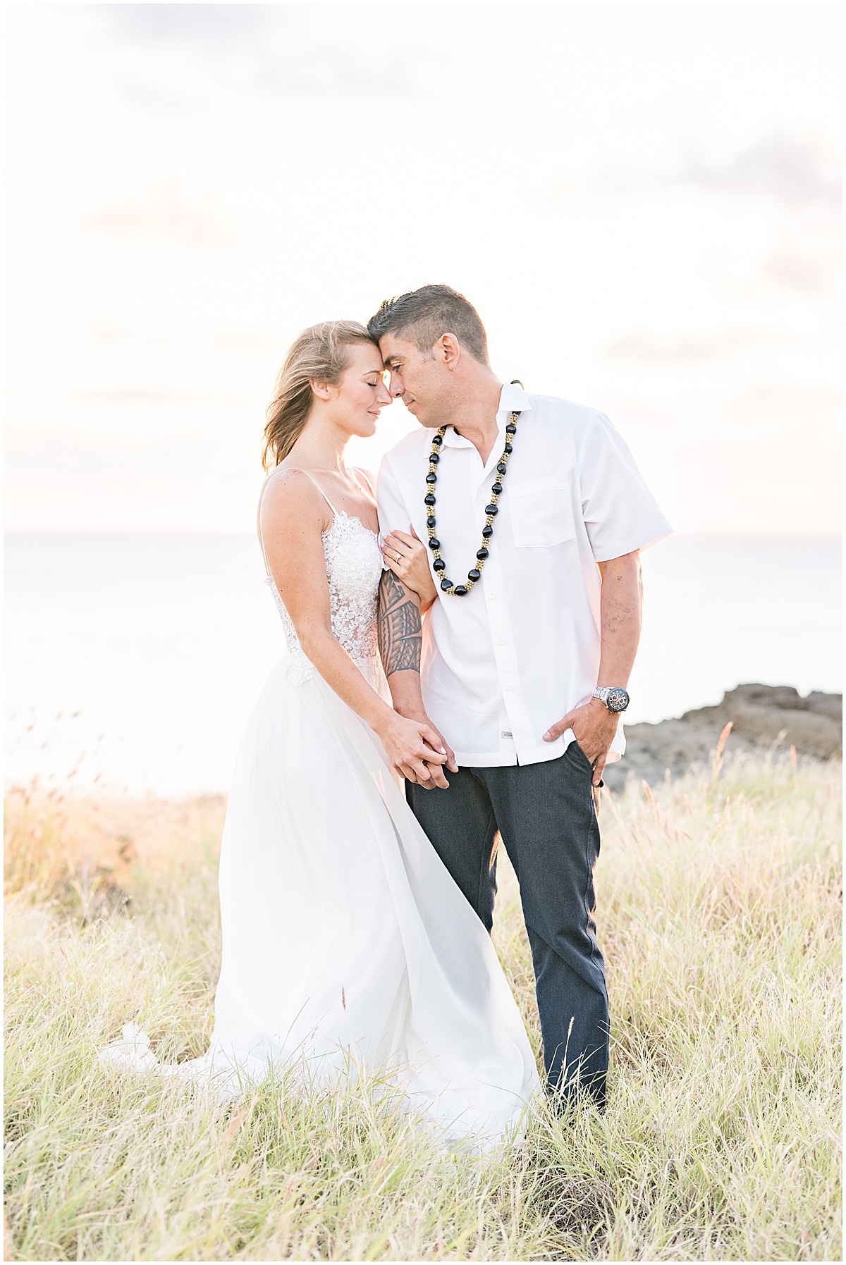 Couple hold on to each other at South Point Hawaii elopement photographed by Victoria Rayburn Photography