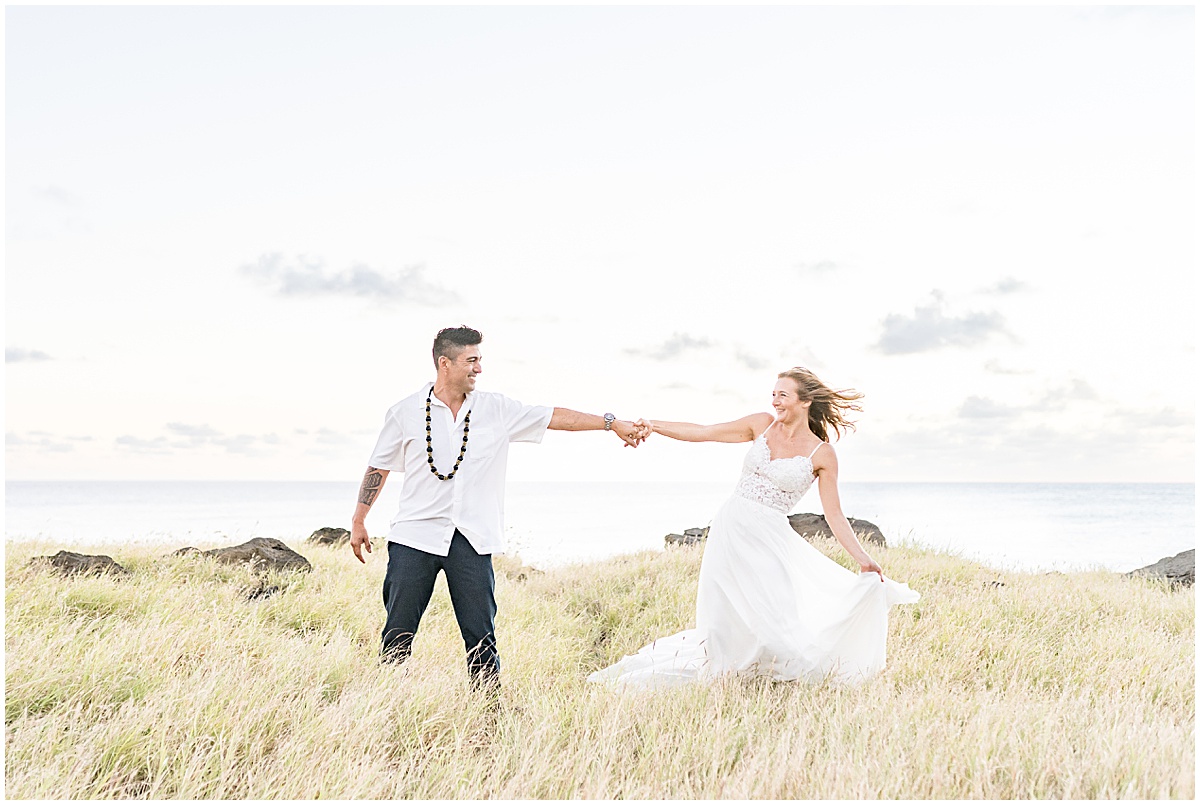 Couple dancing on cliff at South Point Hawaii elopement photographed by Victoria Rayburn Photography