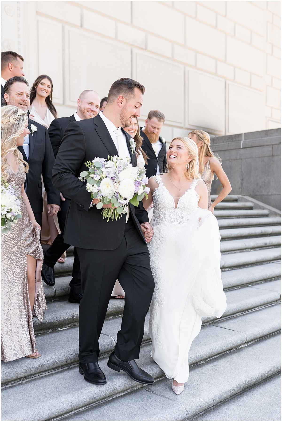 Bridal party walks down steps at Purdue Memorial Union wedding photographed by Victoria Rayburn Photography