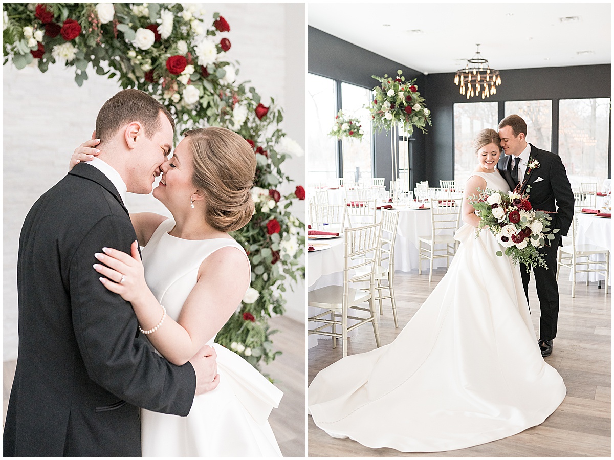 Bride and groom kiss in front of wedding arch at Allure on the Lake wedding in Chesterton, Indiana photographed by Victoria Rayburn Photography