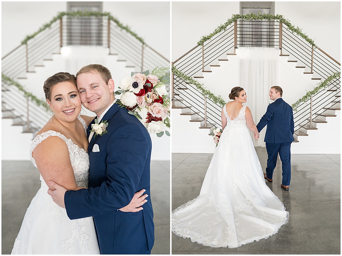 Bride and groom hug in front of staircase for December wedding at New Journey Farms in Lafayette, Indiana photographed by Victoria Rayburn Photography