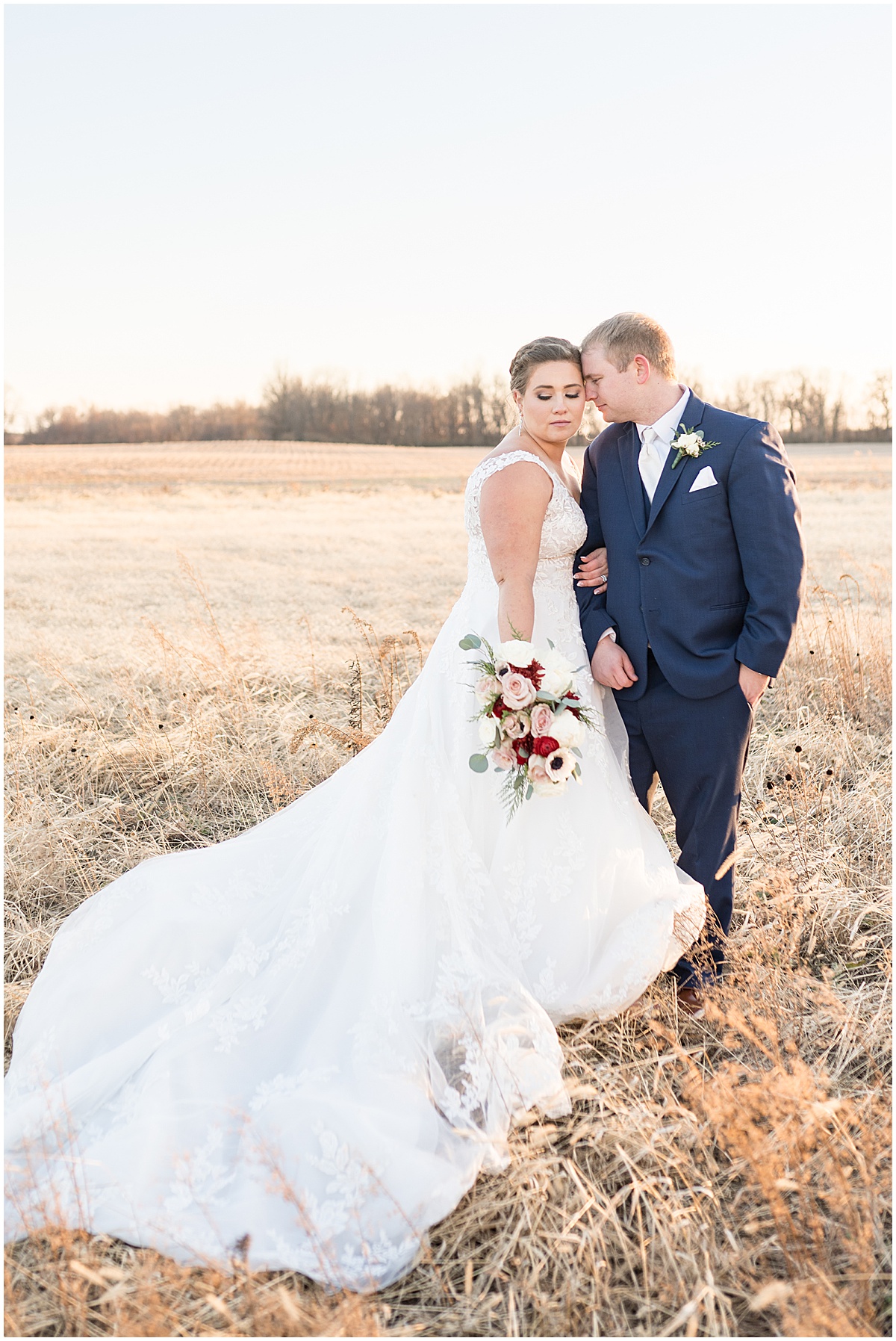 Bride and groom get close during sunset photos after December wedding at New Journey Farms in Lafayette, Indiana photographed by Victoria Rayburn Photography
