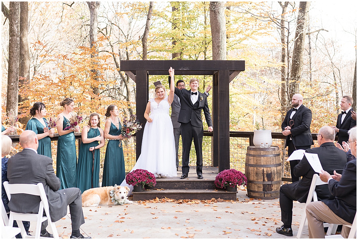 Newlyweds celebrate after ceremony at fall wedding at 3 Fat Labs in Greencastle, Indiana photographed by Victoria Rayburn Photography