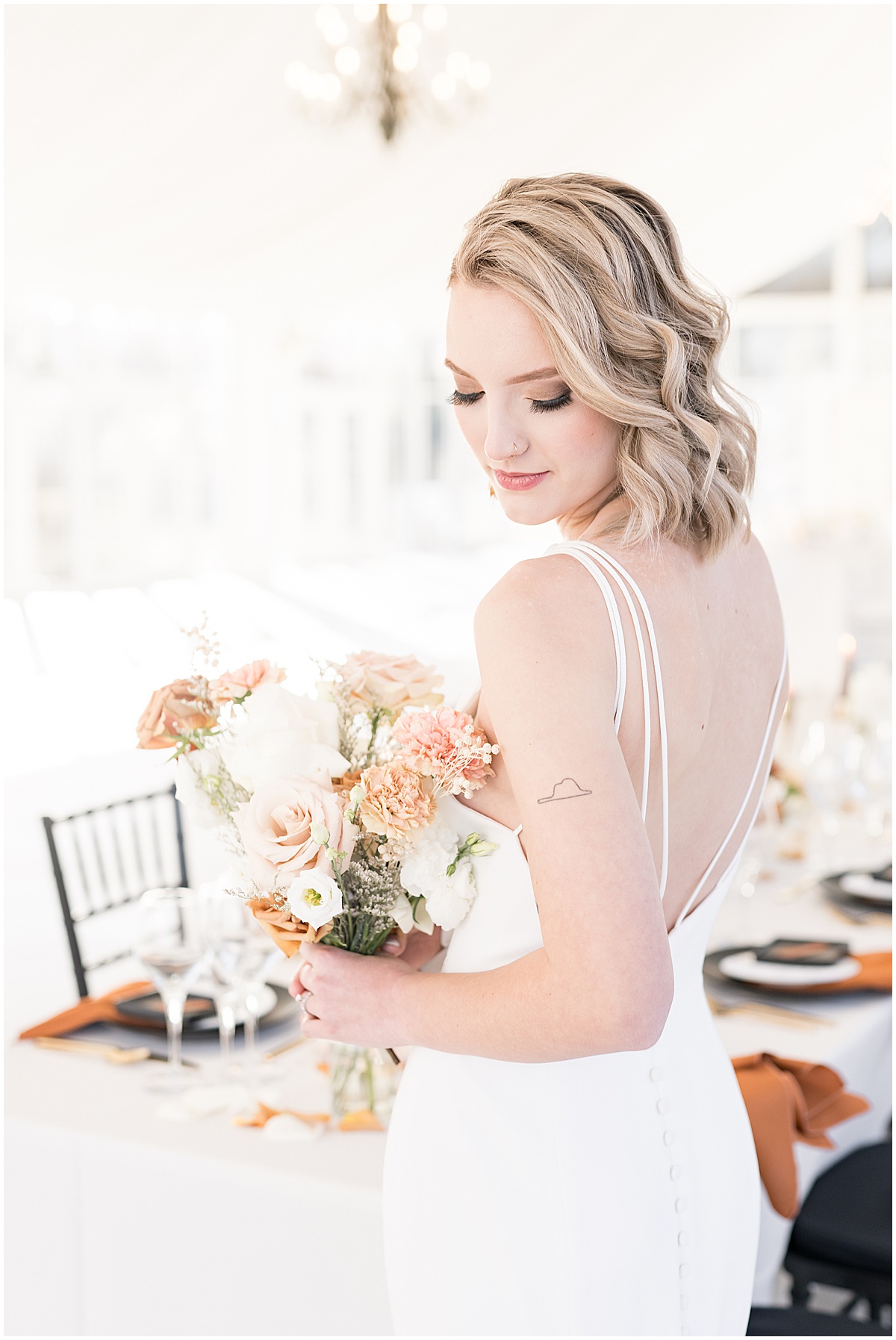 Bride holding bouquet at fall wedding at The Ritz Charles Garden Pavilion in Carmel, Indiana photographed by Victoria Rayburn Photography