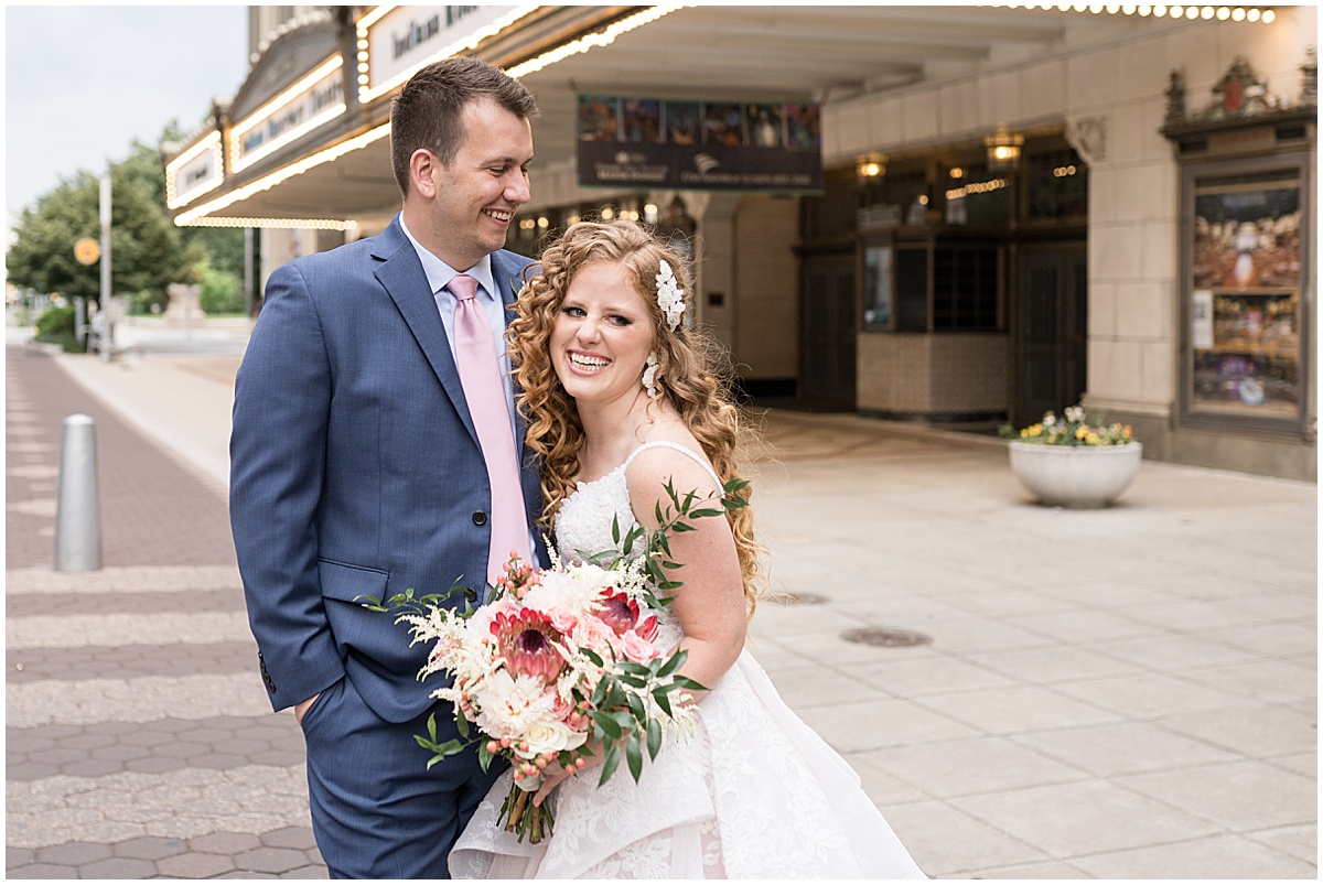 Bride and groom laughing downtown at Indianapolis Artsgarden wedding photographed by Victoria Rayburn Photography