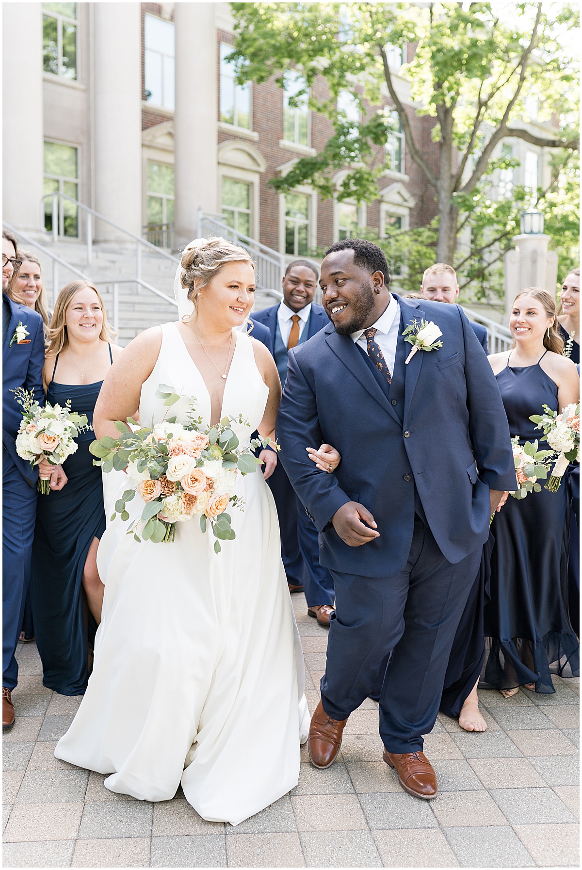 Bridal party walking together at Purdue Memorial Union wedding photographed by Victoria Rayburn Photography