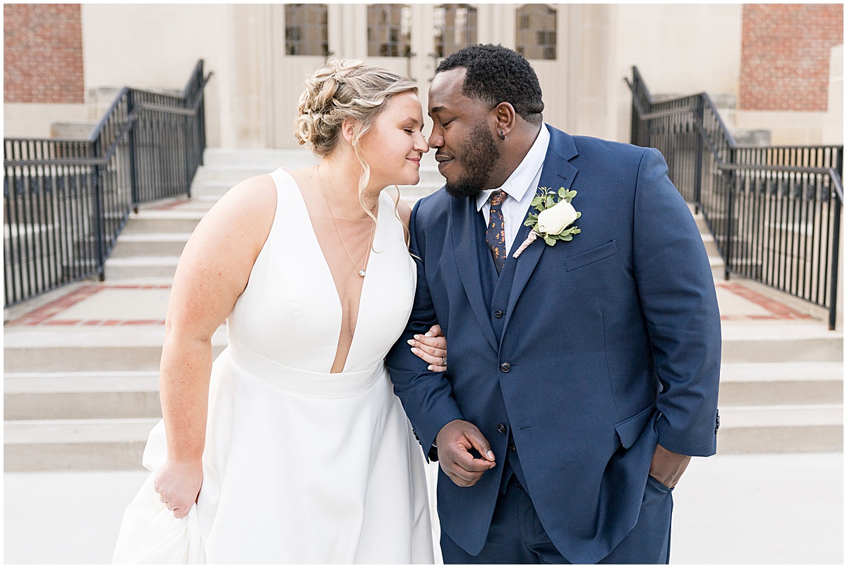 Bride and groom get close after Purdue Memorial Union wedding photographed by Victoria Rayburn Photography