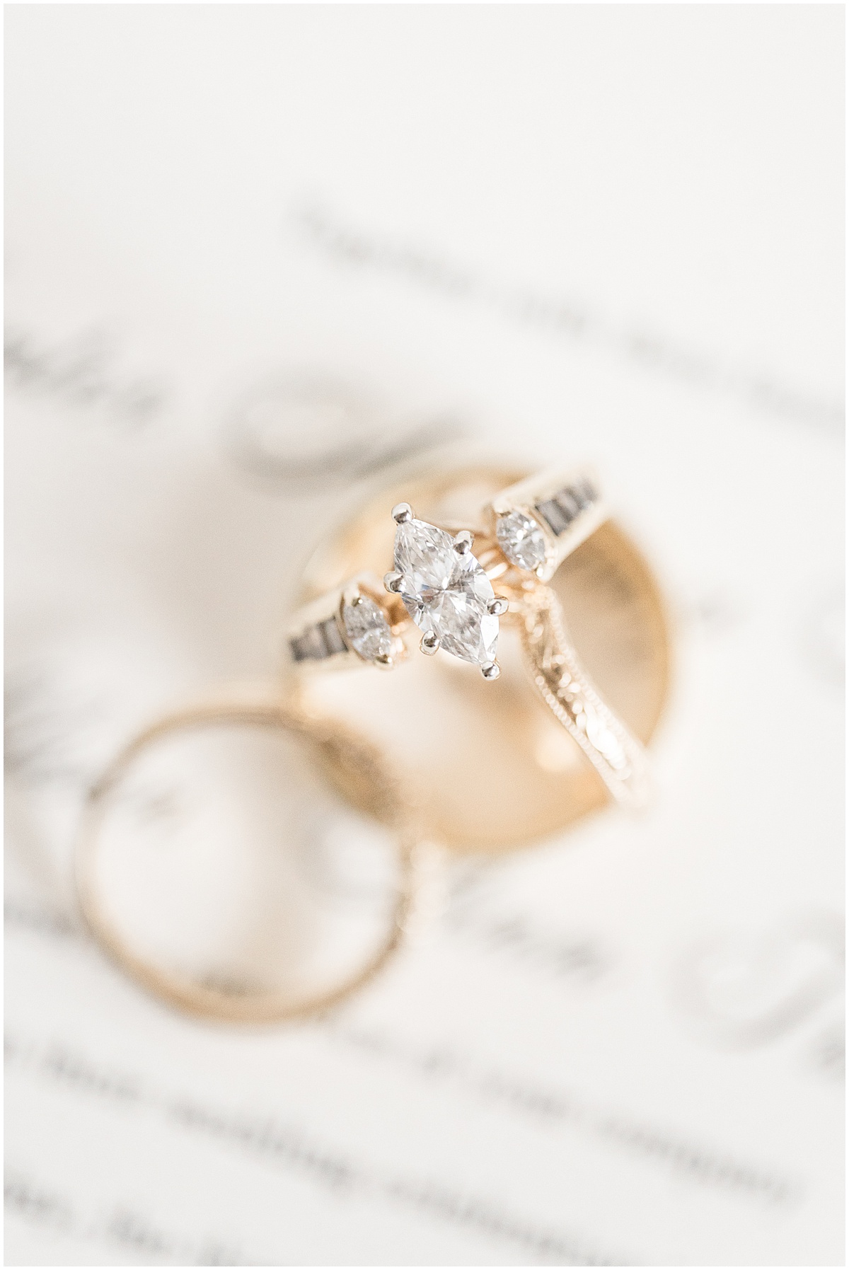 Close up of gold wedding rings for wedding in Converse, Indiana photographed by Victoria Rayburn Photography