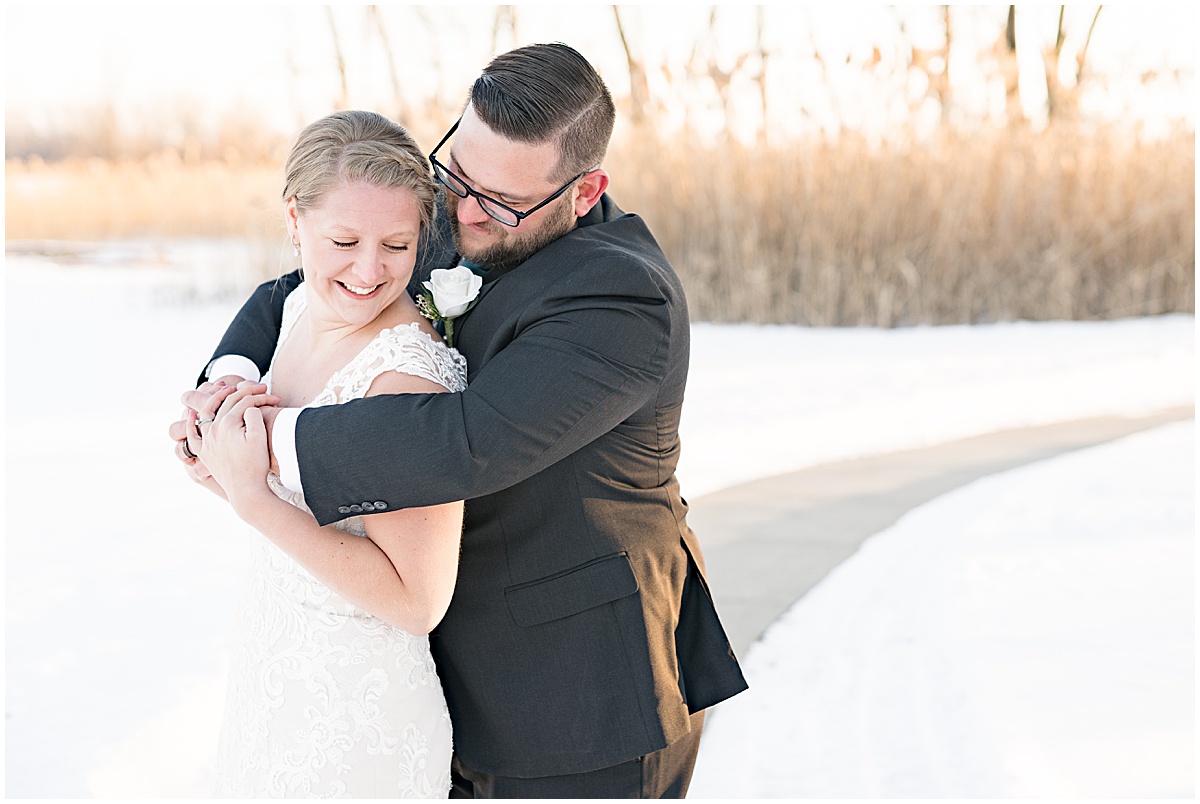 Couple hugging during wedding photos at Centennial Park in Orland Park, Illinois photographed by Victoria Rayburn Photography