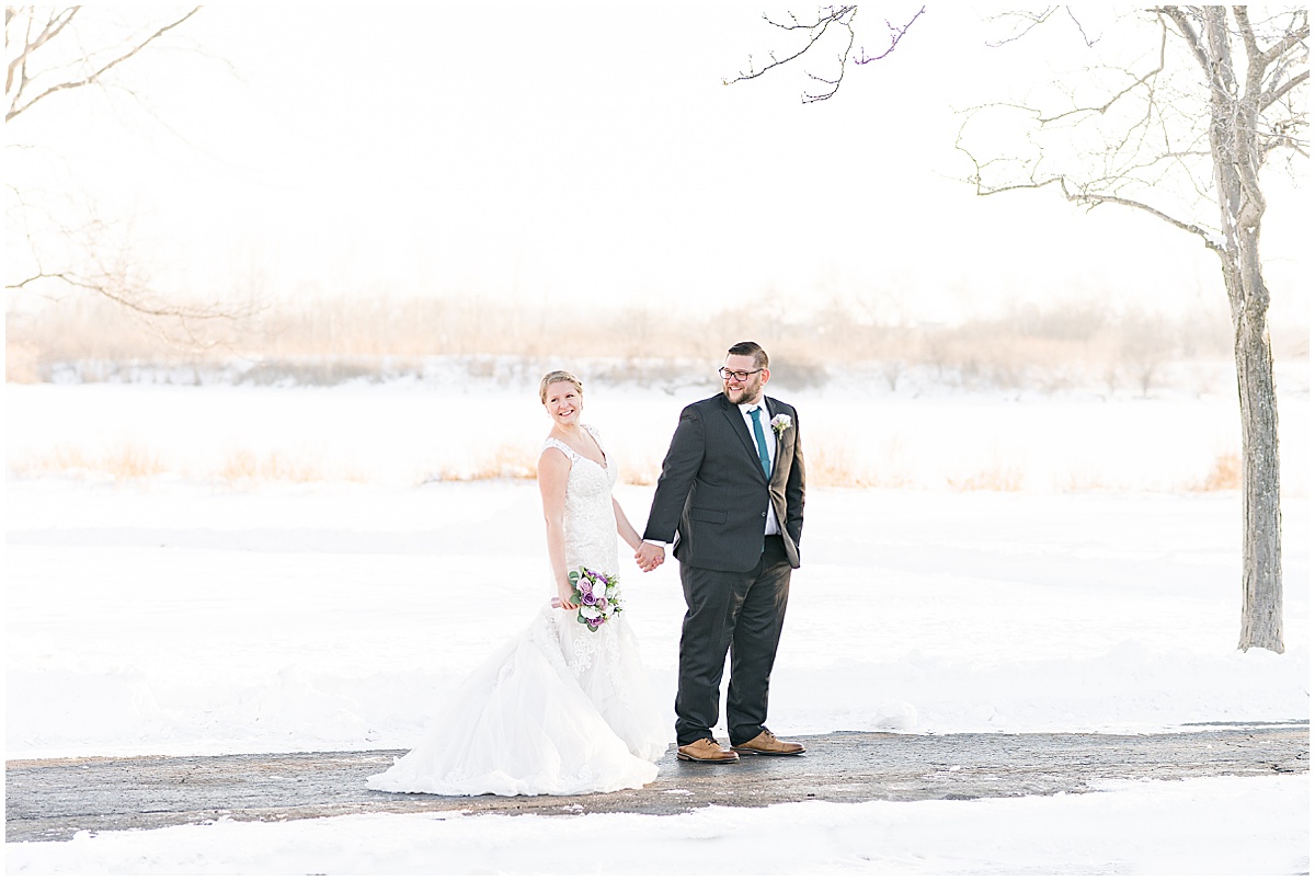 Couple walk on path during wedding photos at Centennial Park in Orland Park, Illinois photographed by Victoria Rayburn Photography