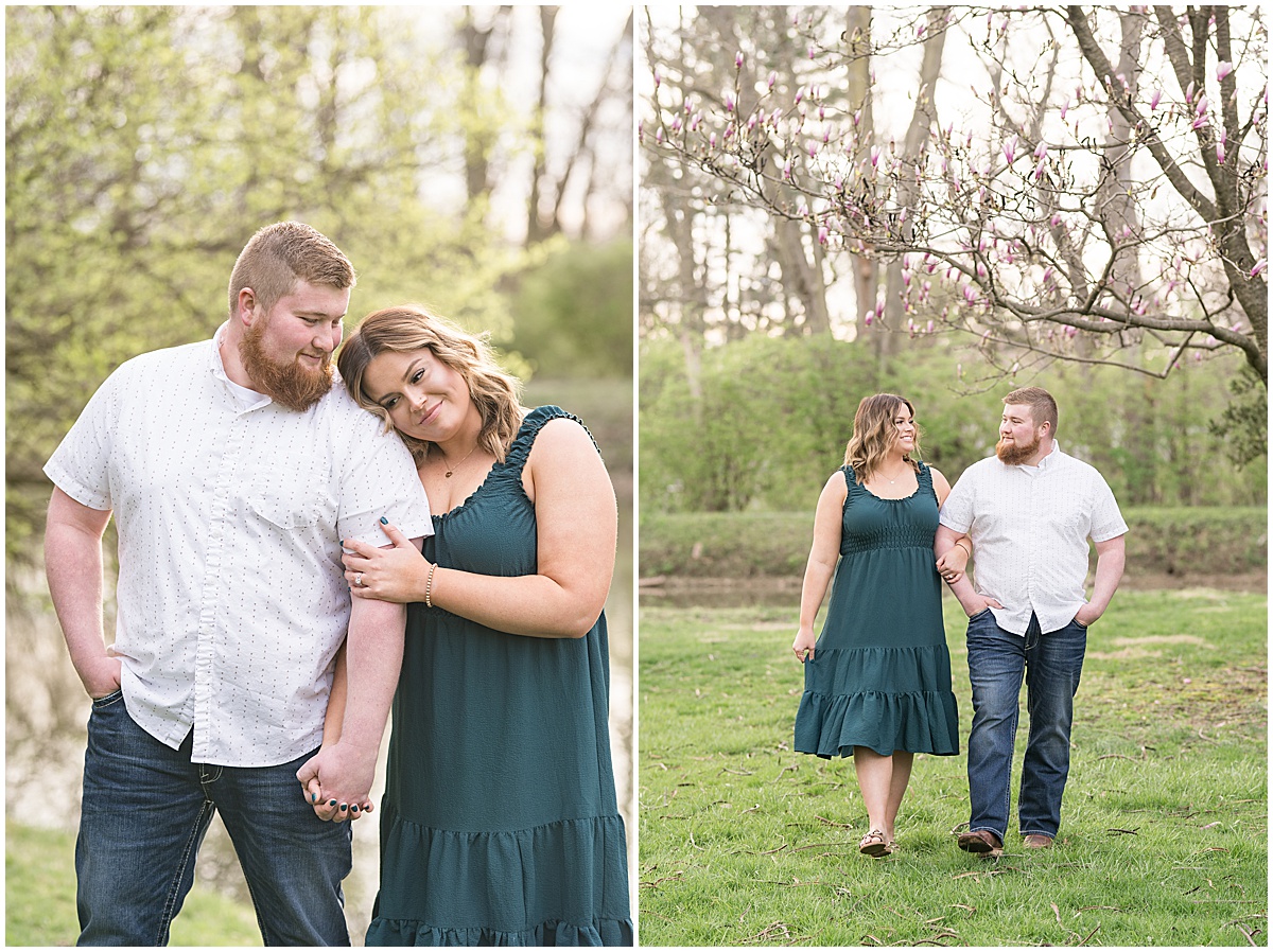 Couple walk under spring flowers at Holcomb Gardens spring engagement photos
