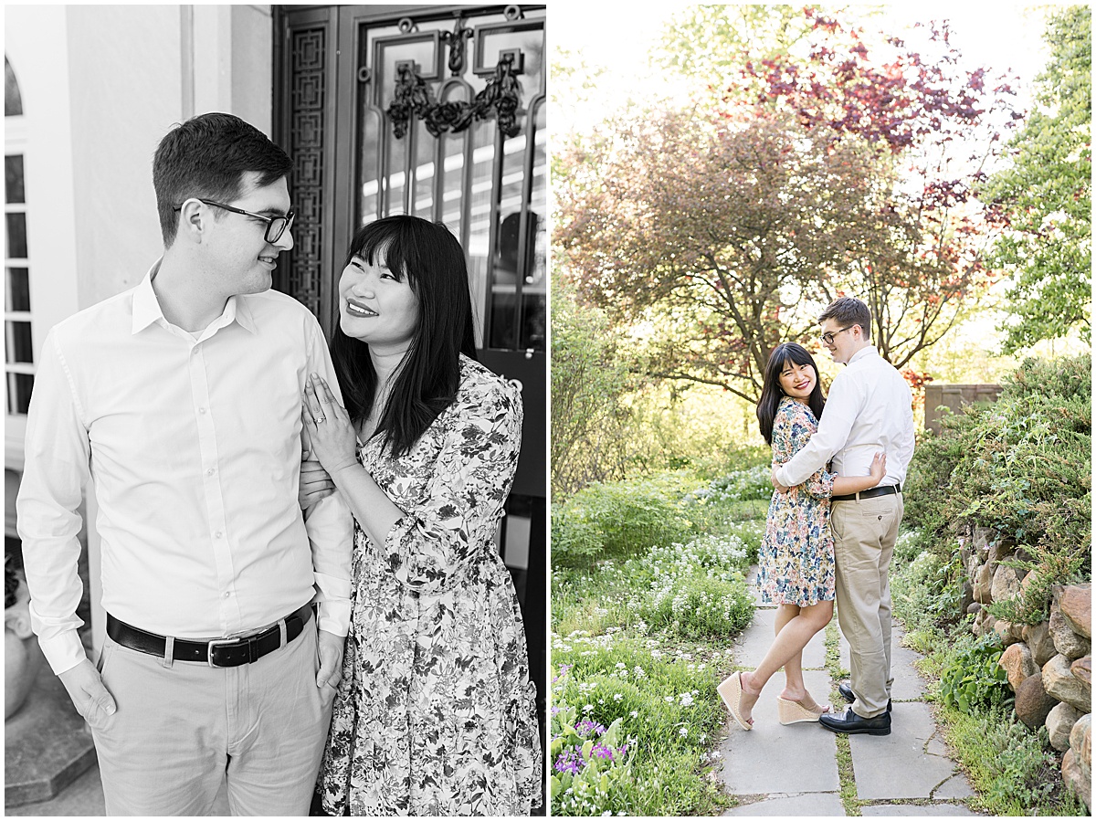 Couple walks on trail with flowers at engagement photos at Newfields in Indianapolis.