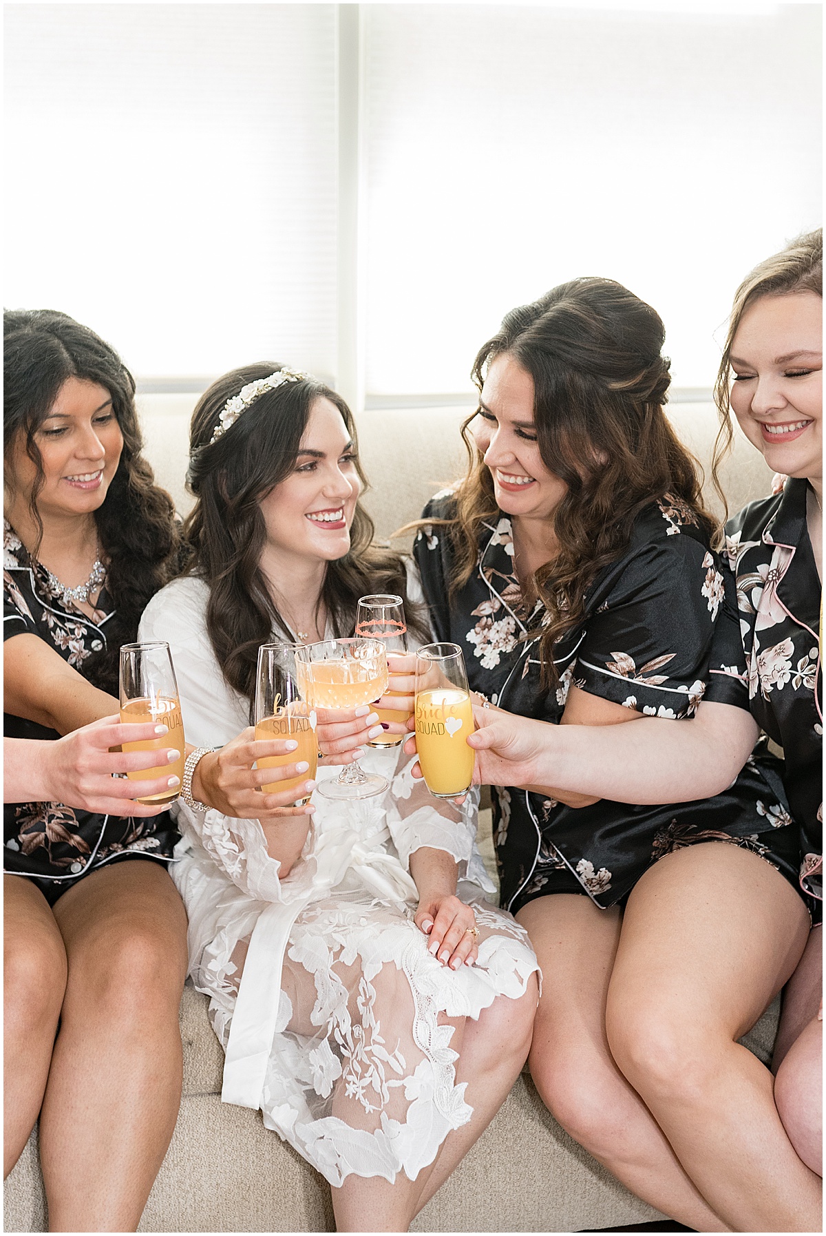 Bride and bridesmaids with mimosas before Historic Saint Joseph Hall wedding in Indianapolis