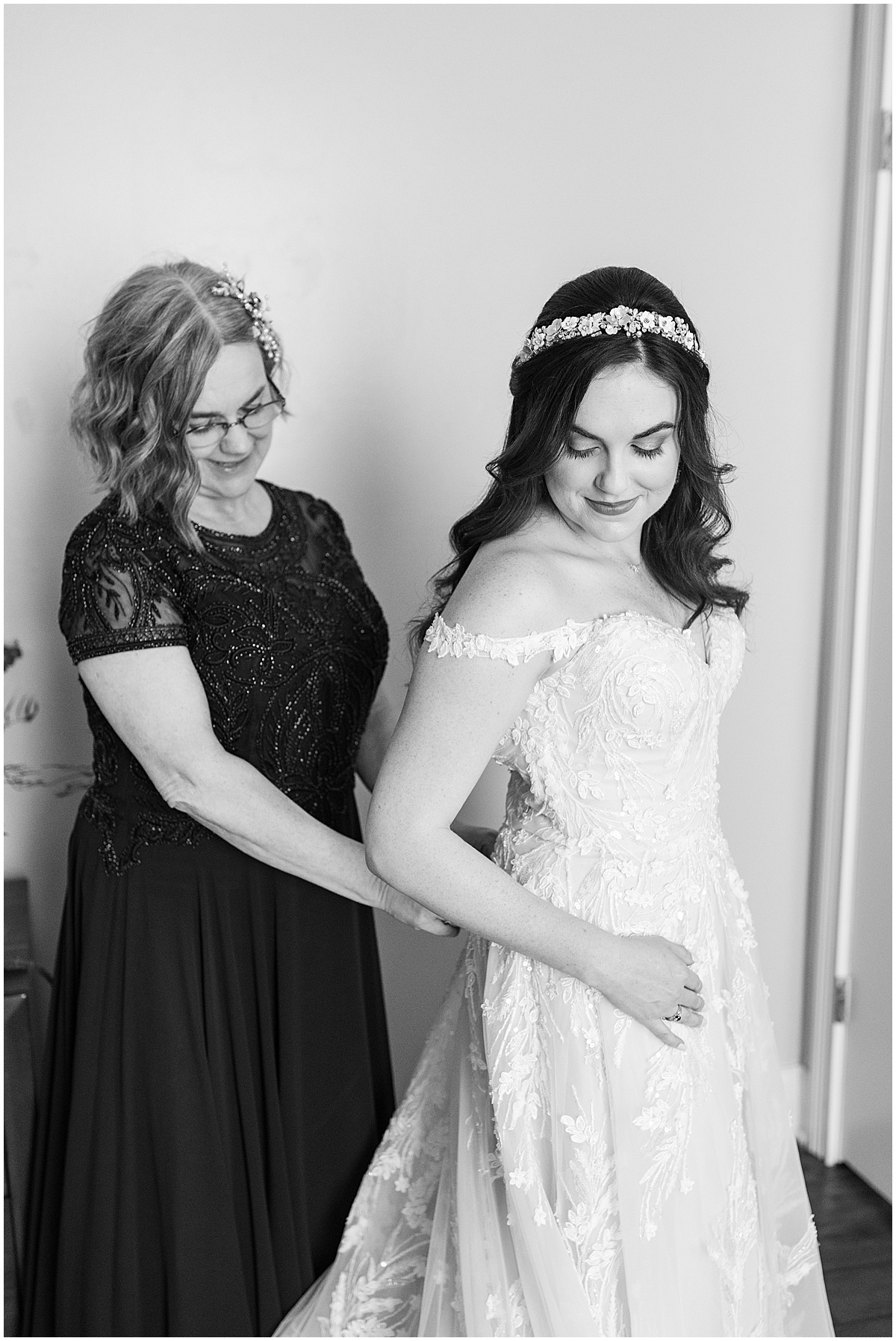 Bride getting ready with the help of her mom for Historic Saint Joseph Hall wedding in Indianapolis