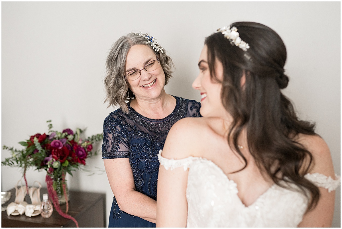 Bride getting ready with the help of her mom for Historic Saint Joseph Hall wedding in Indianapolis