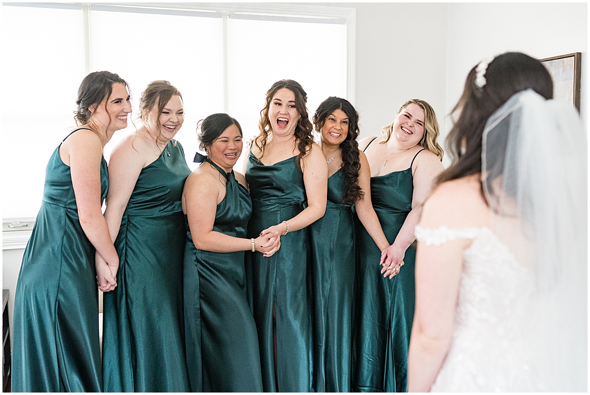 Bride's first look with bridesmaids before Historic Saint Joseph Hall wedding in Indianapolis