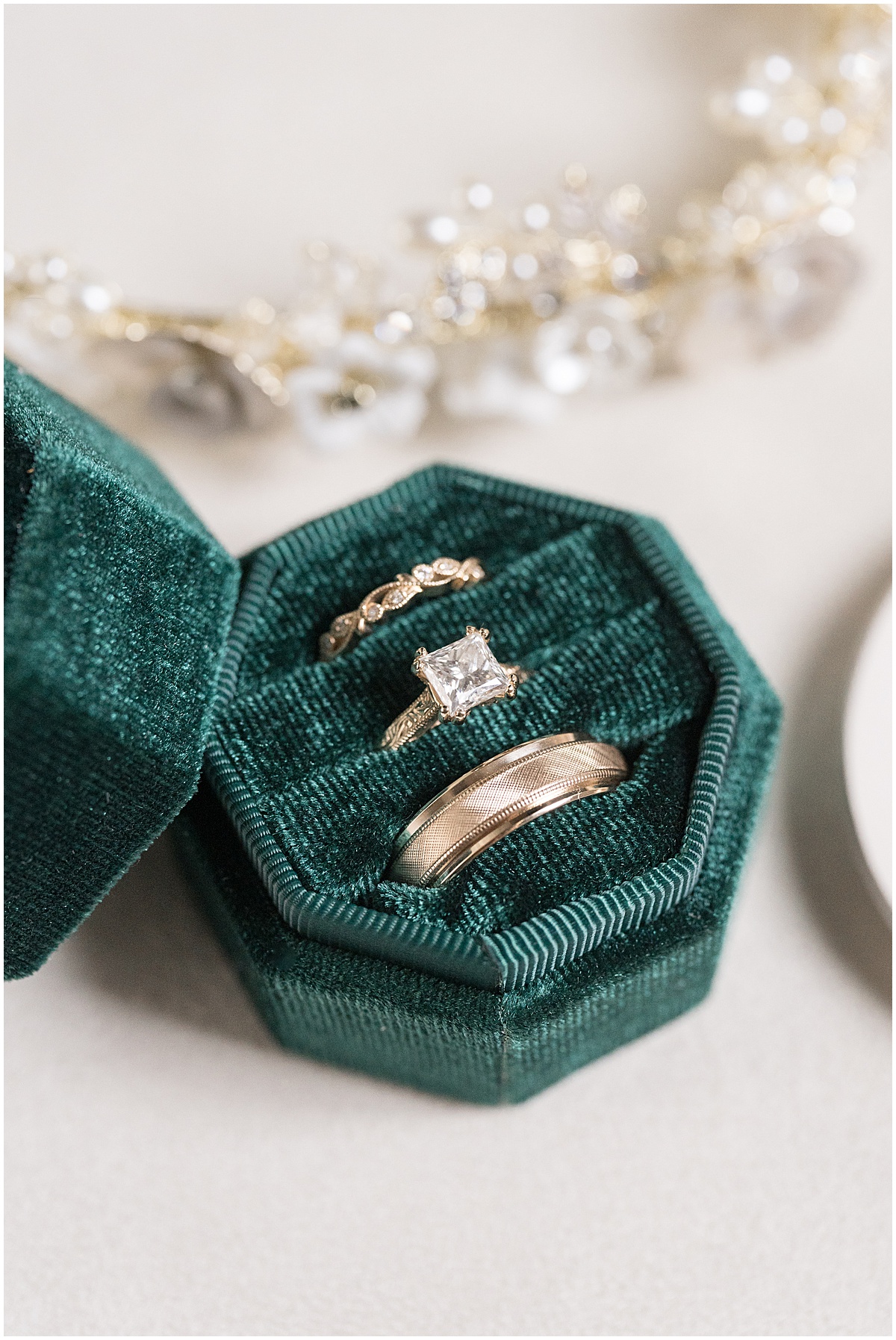 Wedding rings in green ring box for Historic Saint Joseph Hall wedding in Indianapolis