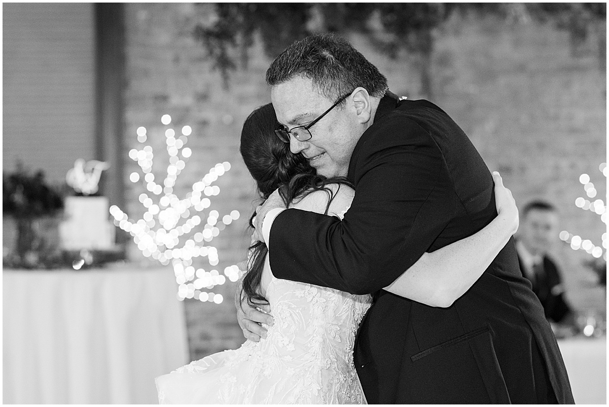 Bride hugging dad after father-daughter dance during Historic Saint Joseph Hall wedding in Indianapolis