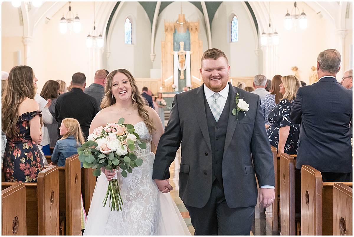 Newlywed exit for wedding at St. Augustine Catholic Church in Rensselaer, Indiana