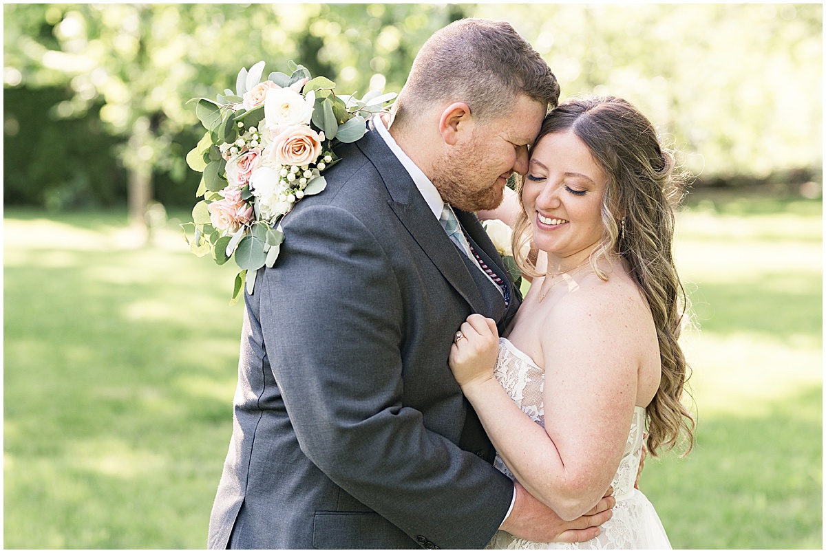 Groom nuzzles brides cheek at Potawatomi Park in Rensselaer, Indiana