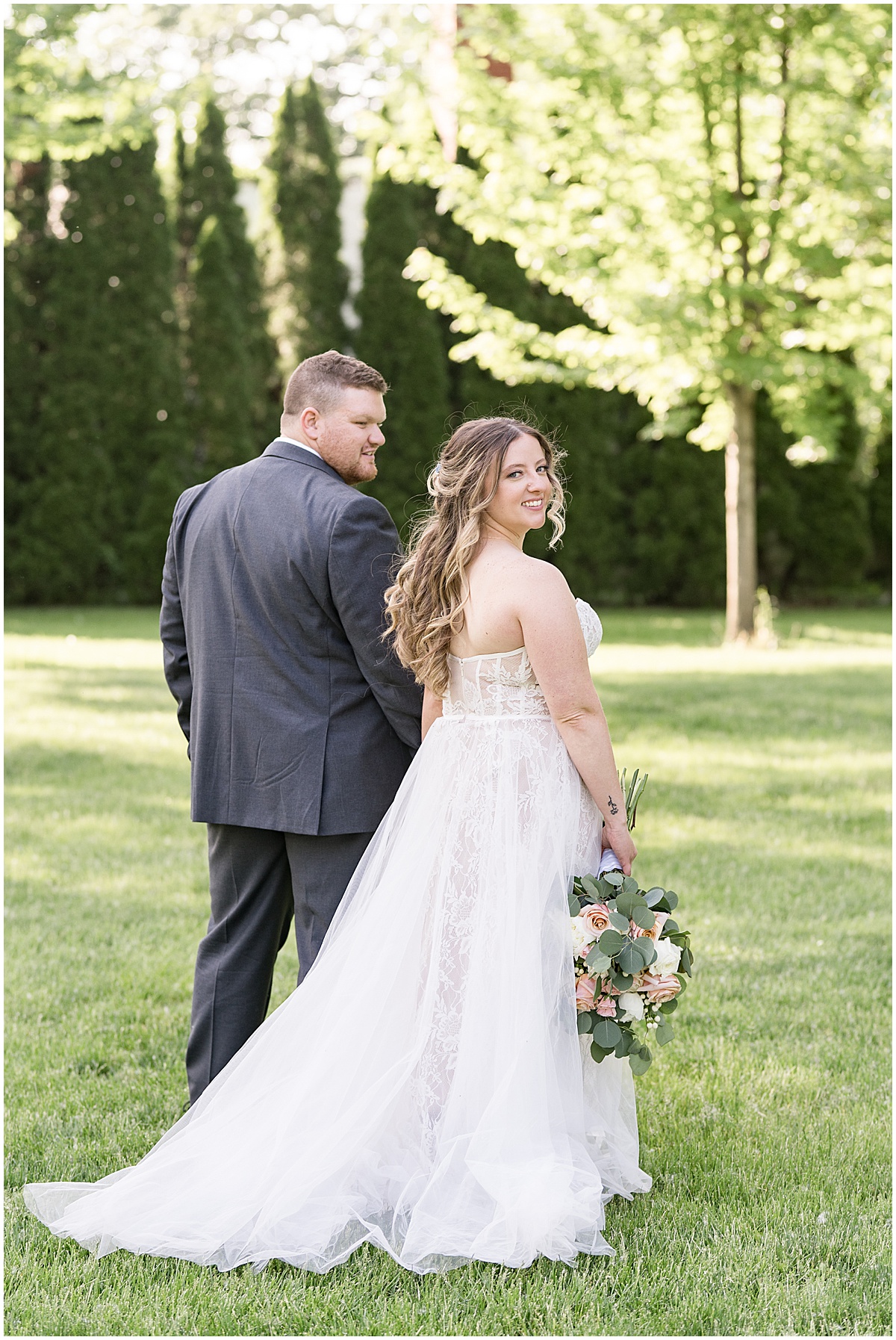 Bride and groom walk together at Potawatomi Park in Rensselaer, Indiana