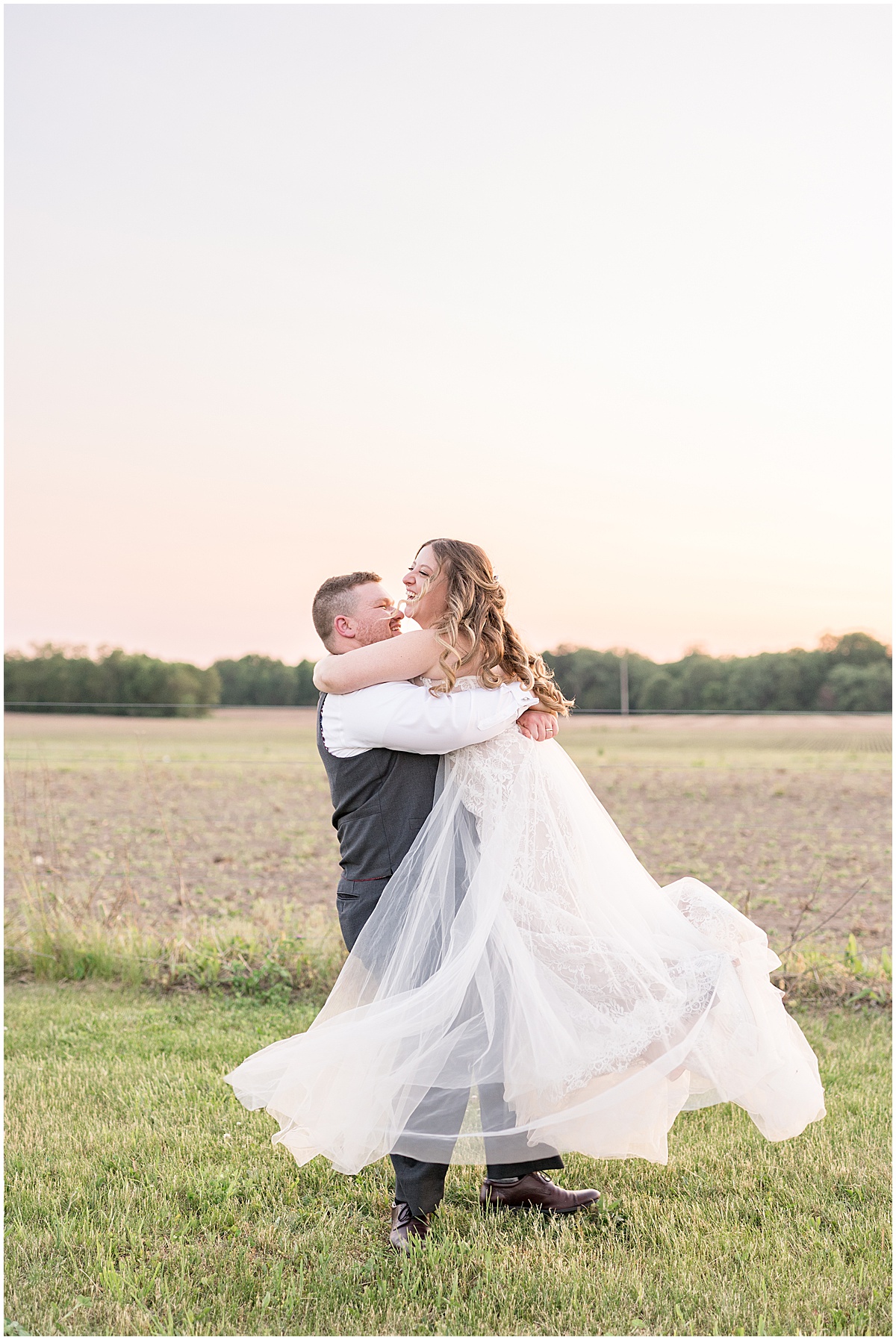 Groom spins bride at sunset after Jasper County Fairgrounds wedding