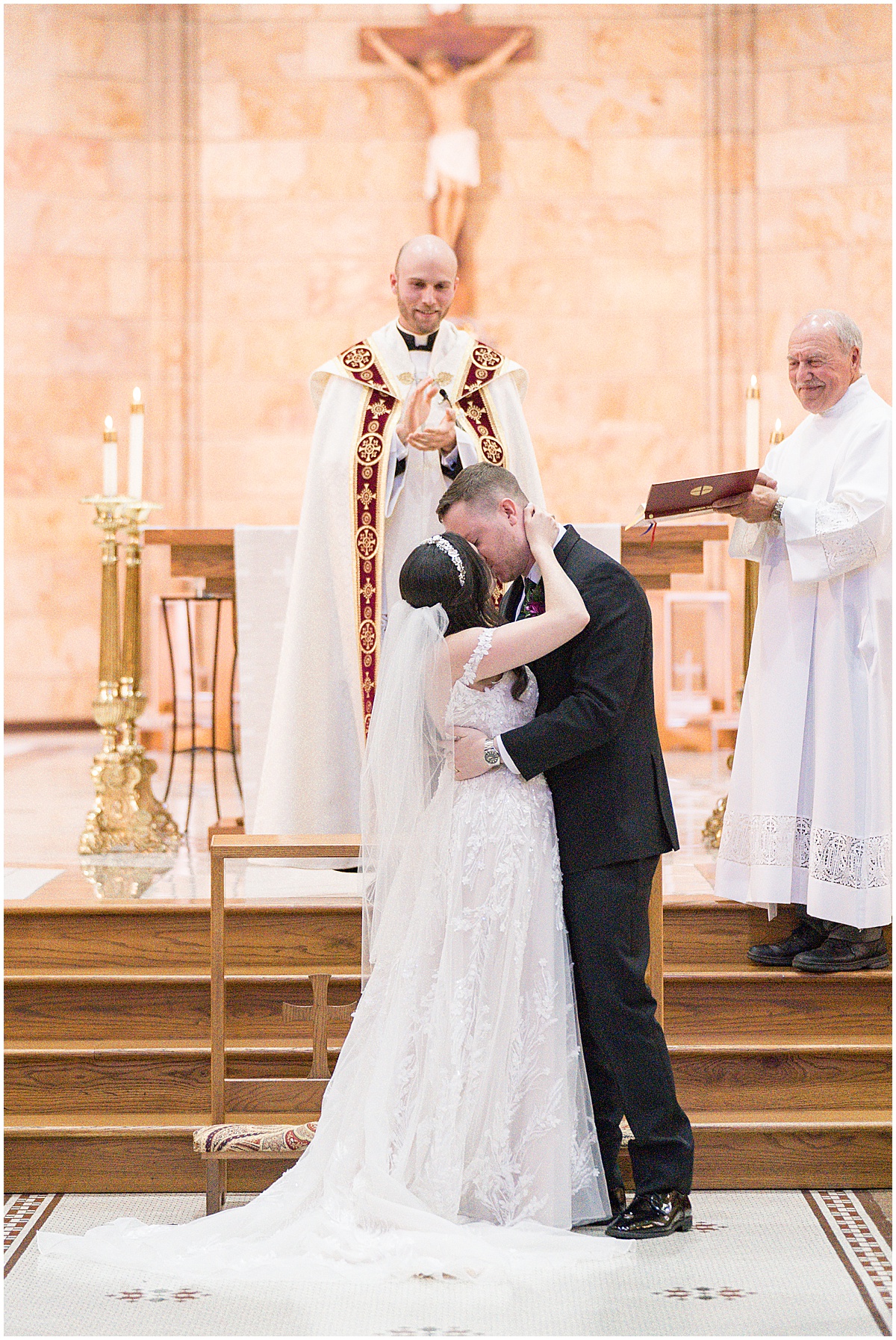 Couple sharing first kiss during Saint Mary's Catholic Cathedral wedding in downtown Indianapolis