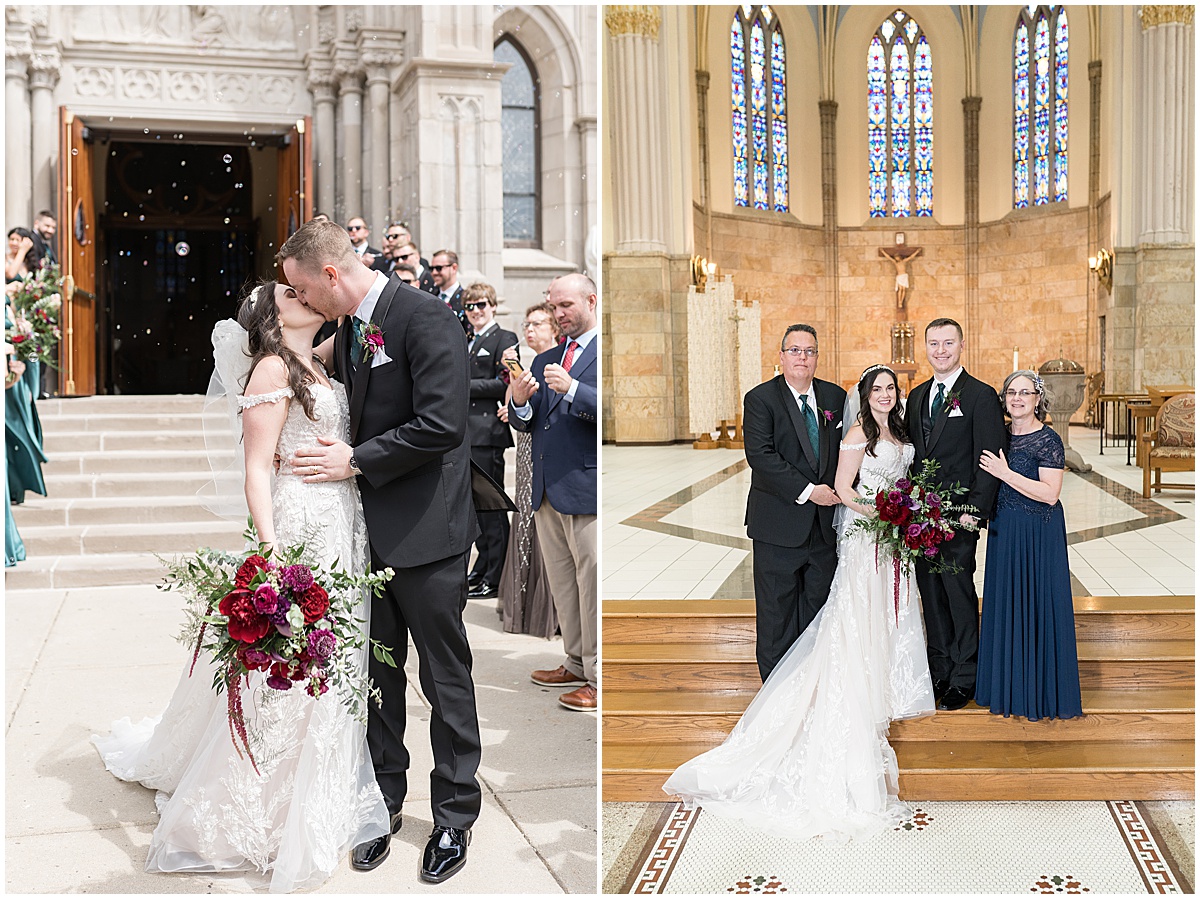 Couple kissing during grand exit from church surrounded by bubbles after Saint Mary's Catholic Cathedral wedding in downtown Indianapolis