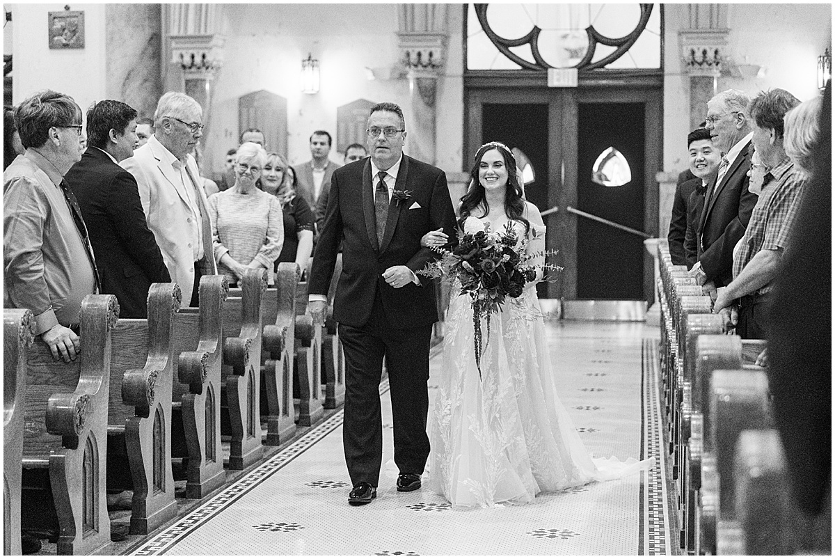 Bride and her father walking down aisle at Saint Mary's Catholic Cathedral wedding in downtown Indianapolis