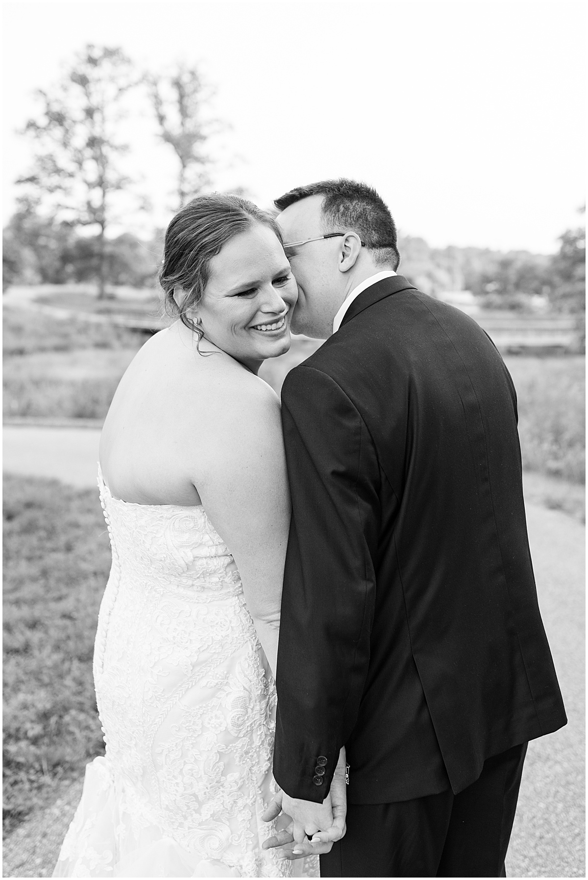 Groom kisses brides cheek after Klubhaus 61 wedding in Jasper, Indiana