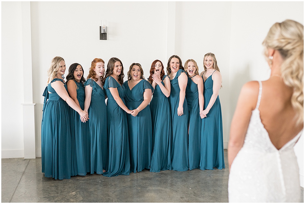 Bridesmaids reaction to bride at wedding at New Journey Farms in Lafayette, Indiana