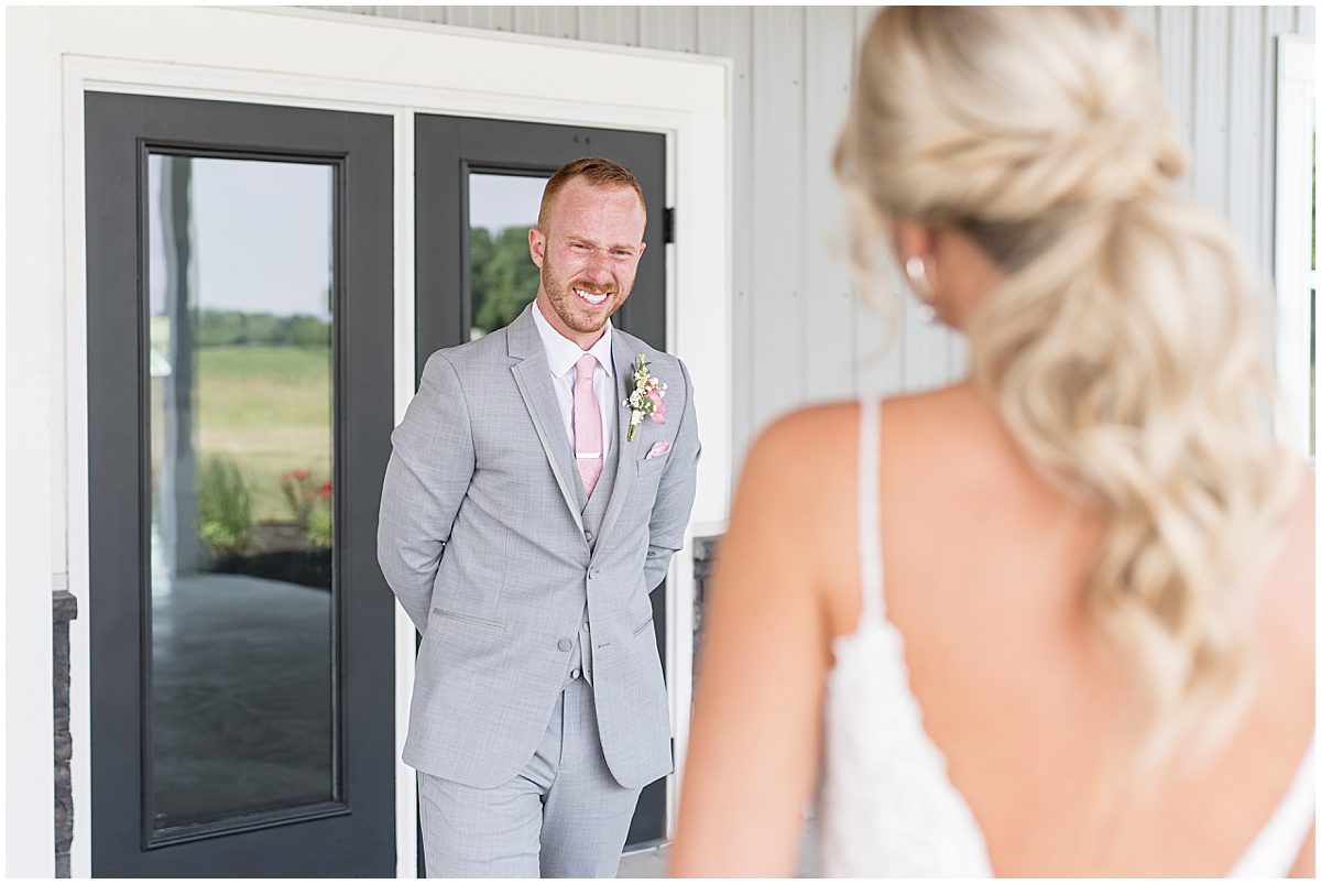 Groom reaction to bride for wedding at New Journey Farms in Lafayette, Indiana