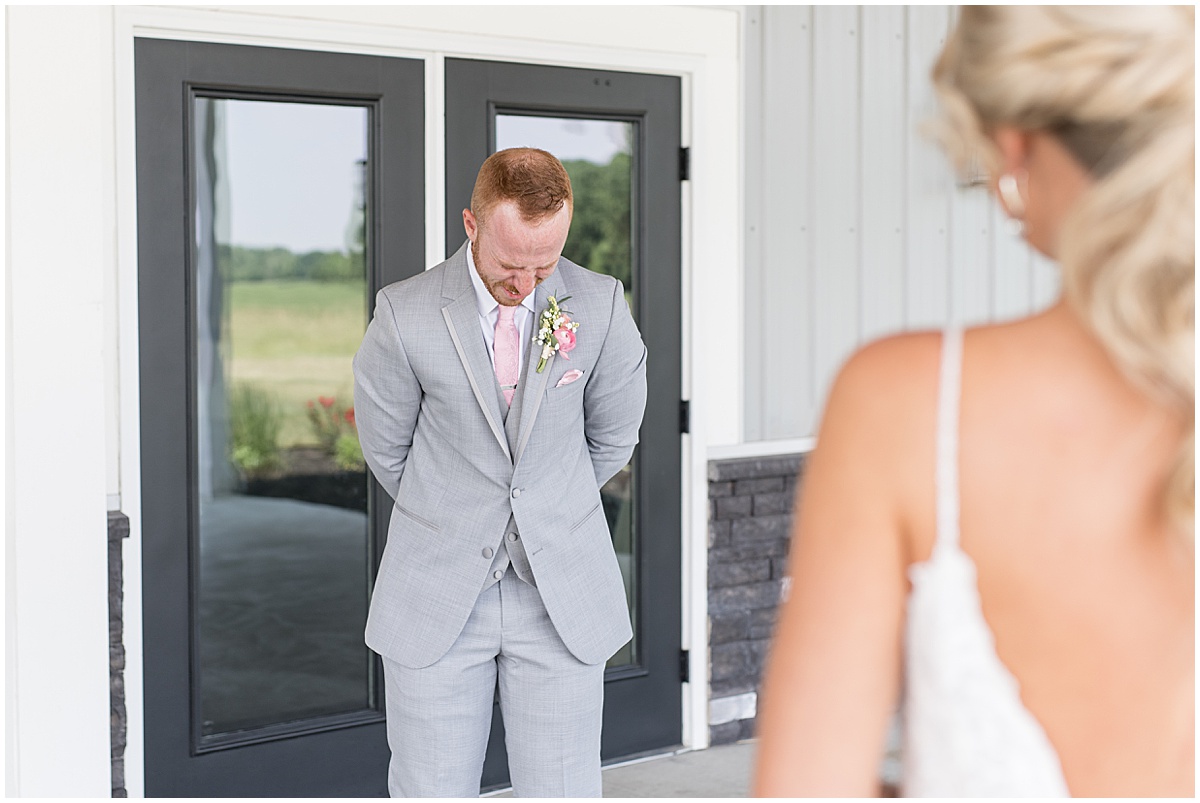 Groom cries when seeing bride at wedding at New Journey Farms in Lafayette, Indiana