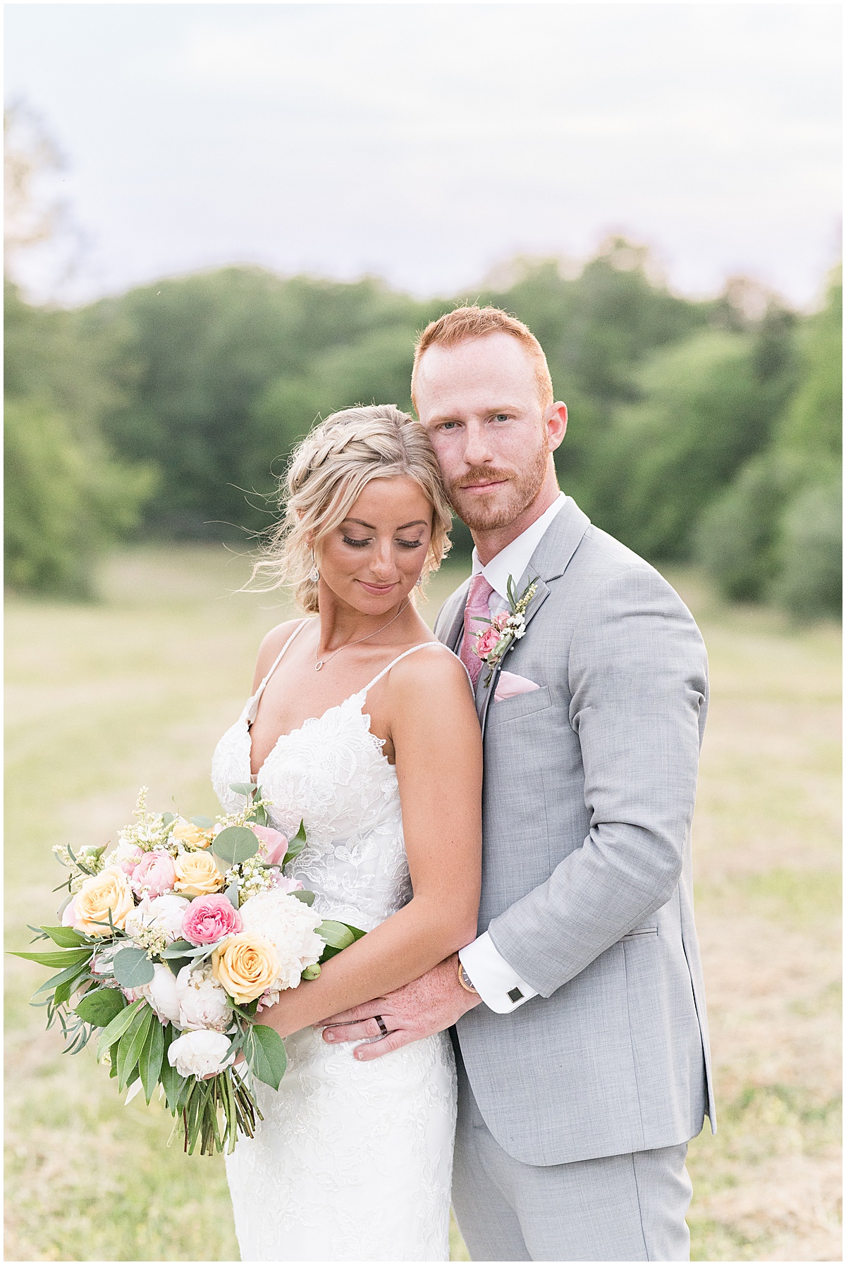 Groom holds on to bride after wedding at New Journey Farms in Lafayette, Indiana