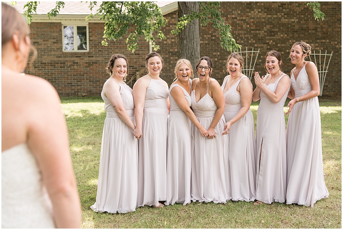 Bridesmaids reaction to bride at St. Joseph Catholic Church in Jasper, Indiana