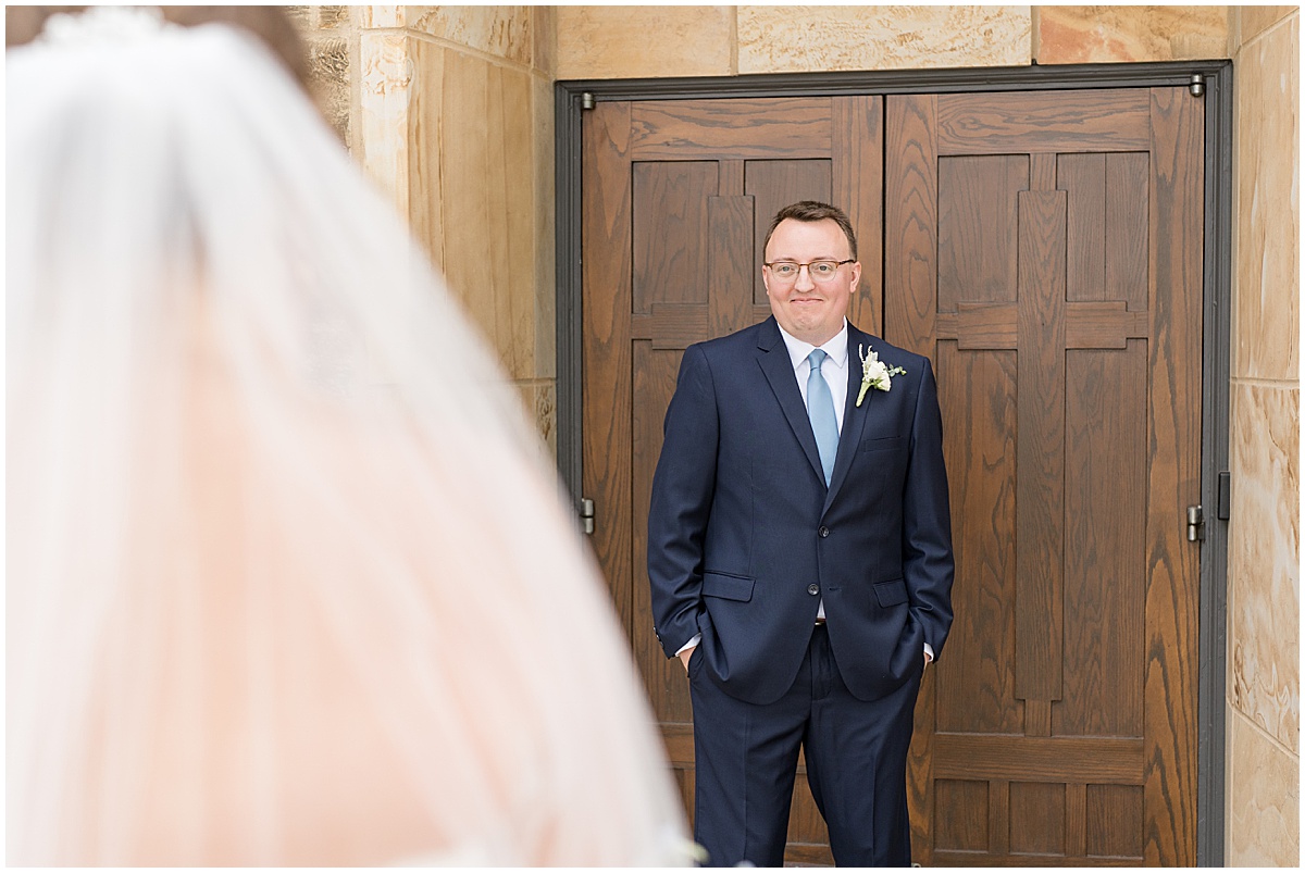 Groom reacts to seeing bride before St. Joseph Catholic Church in Jasper, Indiana