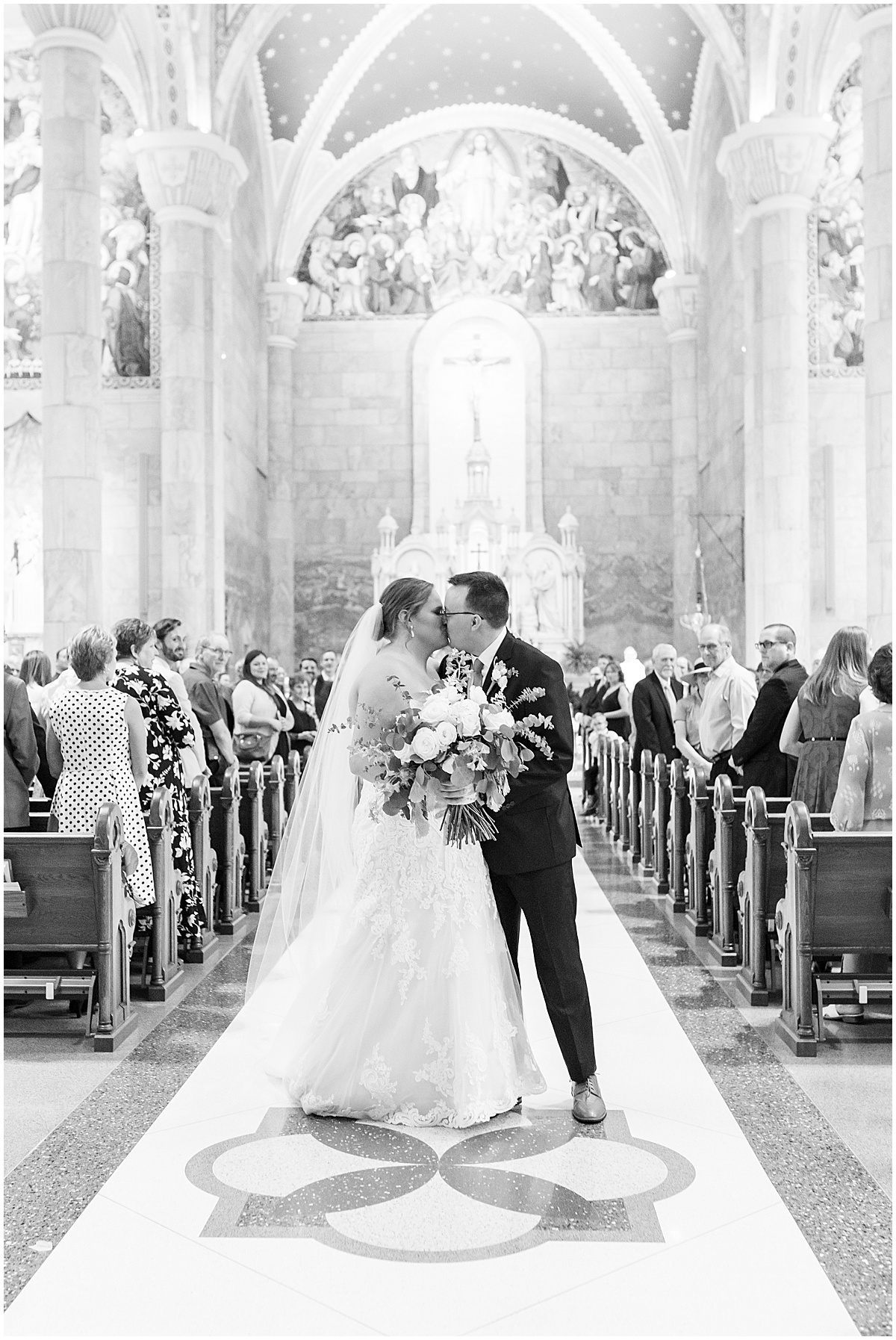 Newlyweds kiss after St. Joseph Catholic Church in Jasper, Indiana