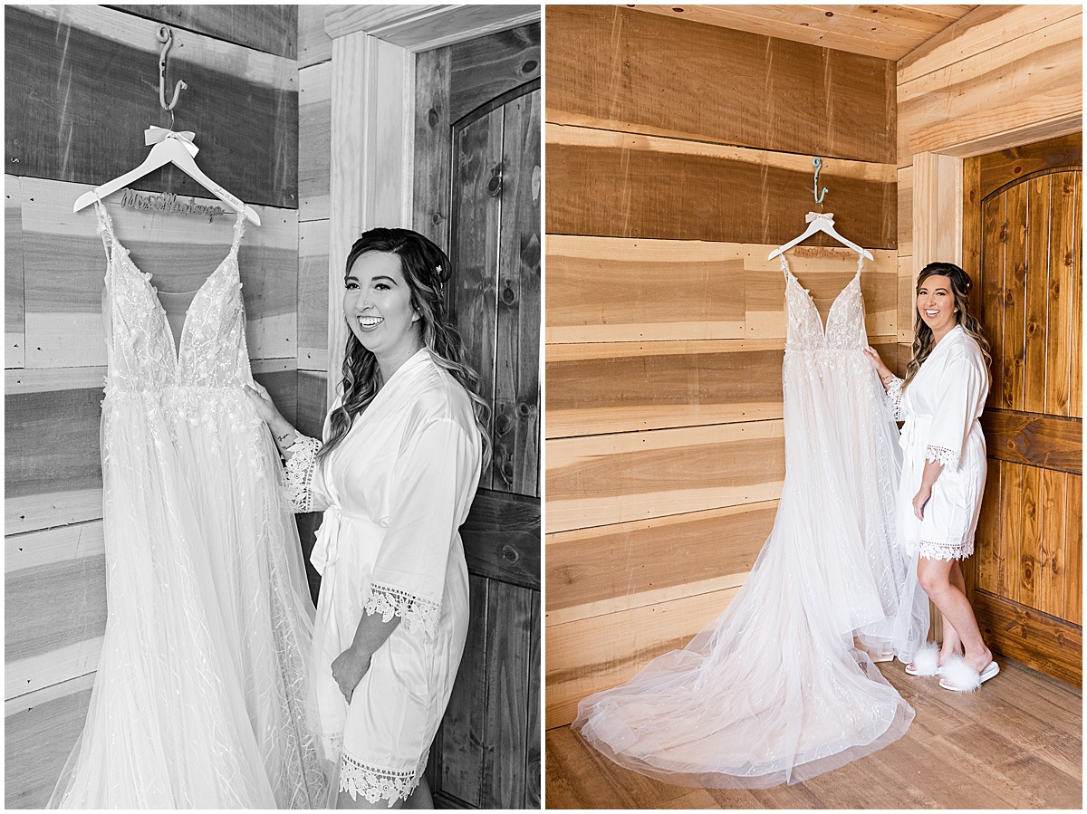 Bride with hanging dress before Stables Event Center wedding in Lafayette, Indiana