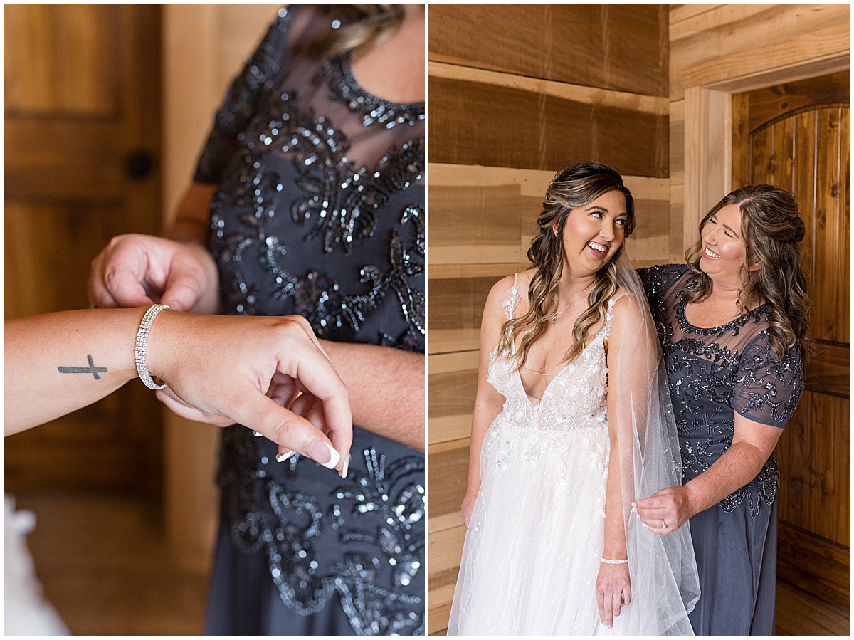 Bride has help putting on bracelet for Stables Event Center wedding in Lafayette, Indiana