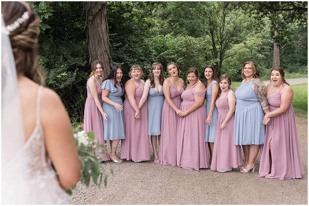 Bridesmaids react to bride before Stables Event Center wedding in Lafayette, Indiana