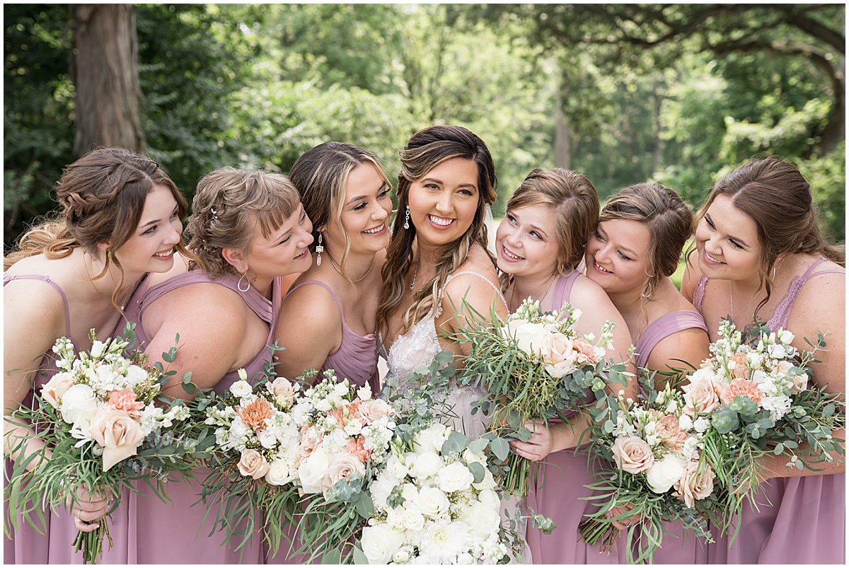 Bridesmaids admire bride at Stables Event Center wedding in Lafayette, Indiana