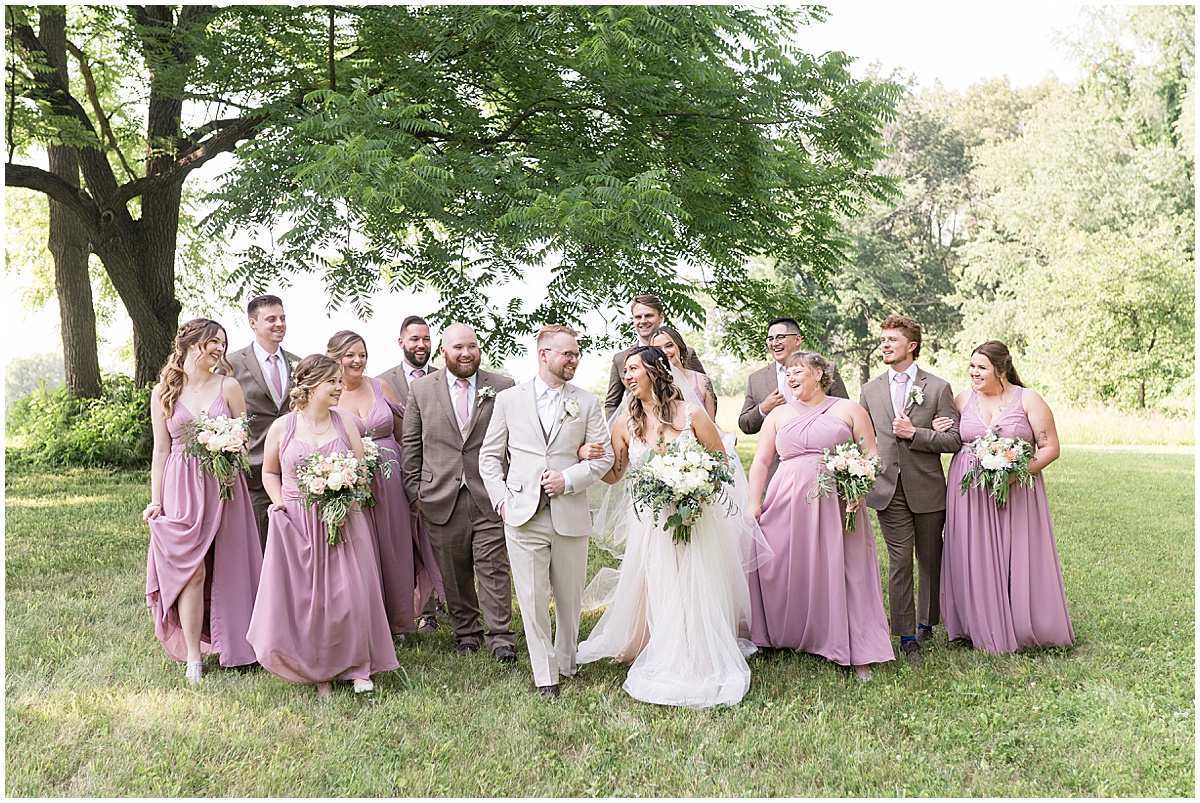 Bridal party walk outside Stables Event Center wedding in Lafayette, Indiana