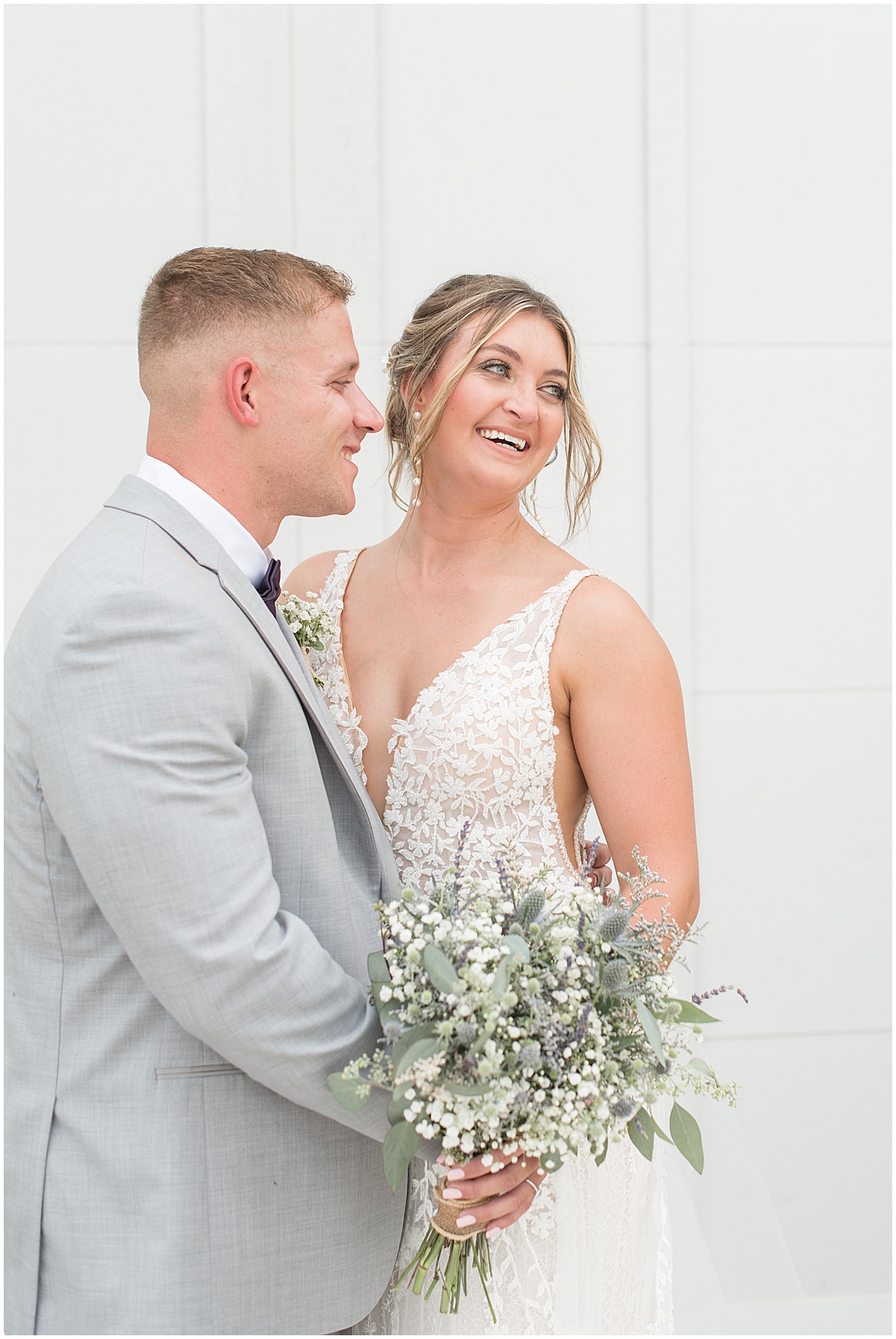 Groom admires bride at White Willow Creek Barn wedding in Frankfort, Indiana