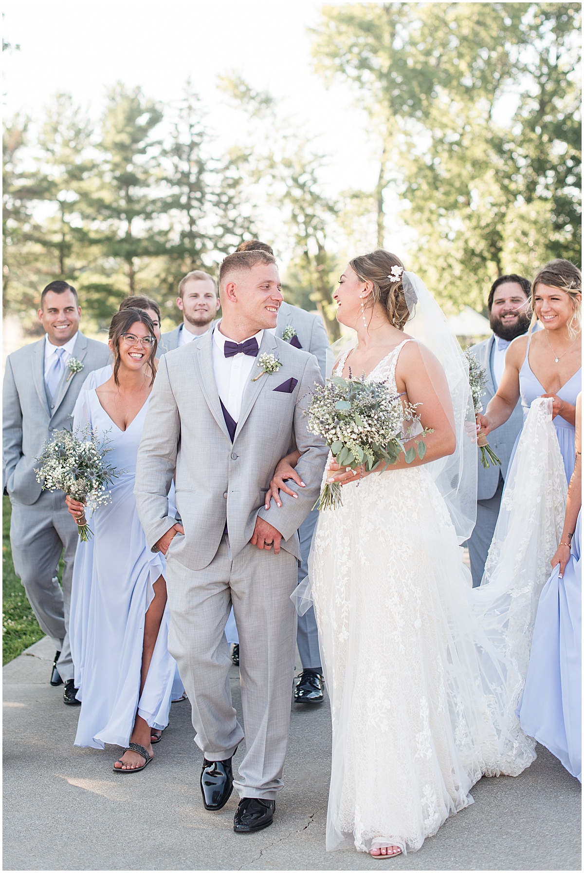 Bridal party walking at White Willow Creek Barn wedding in Frankfort, Indiana