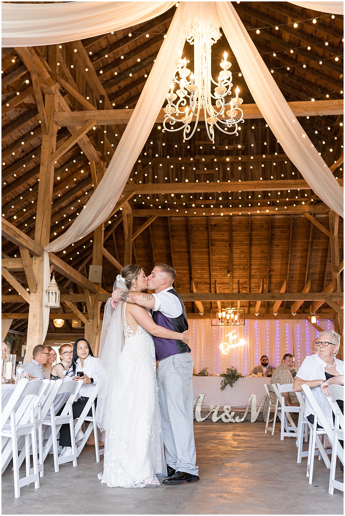 Kissing during first dance at White Willow Creek Barn wedding in Frankfort, Indiana