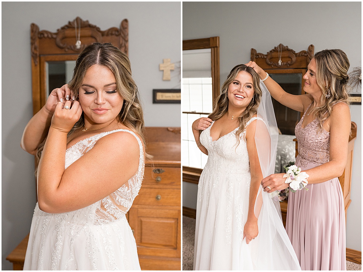 Bride putting on earrings and veil at private property wedding in Peru, Indiana