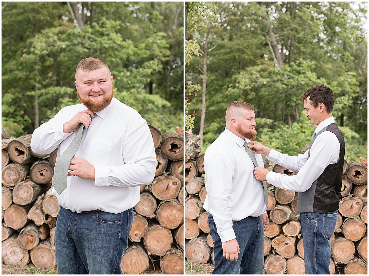 Groom puts on tie before private property wedding in Peru, Indiana