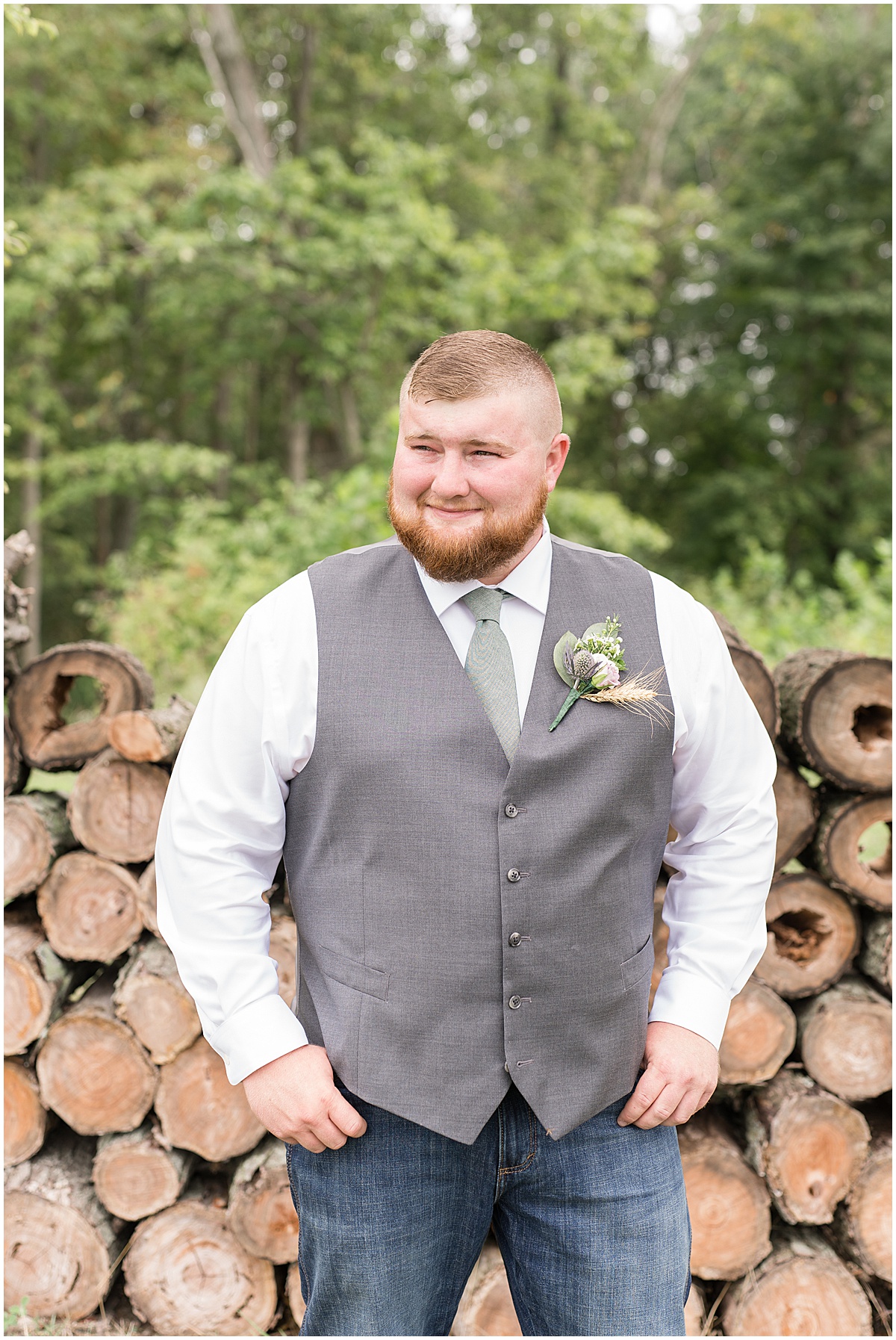 Groom portrait next to woods at private property wedding in Peru, Indiana