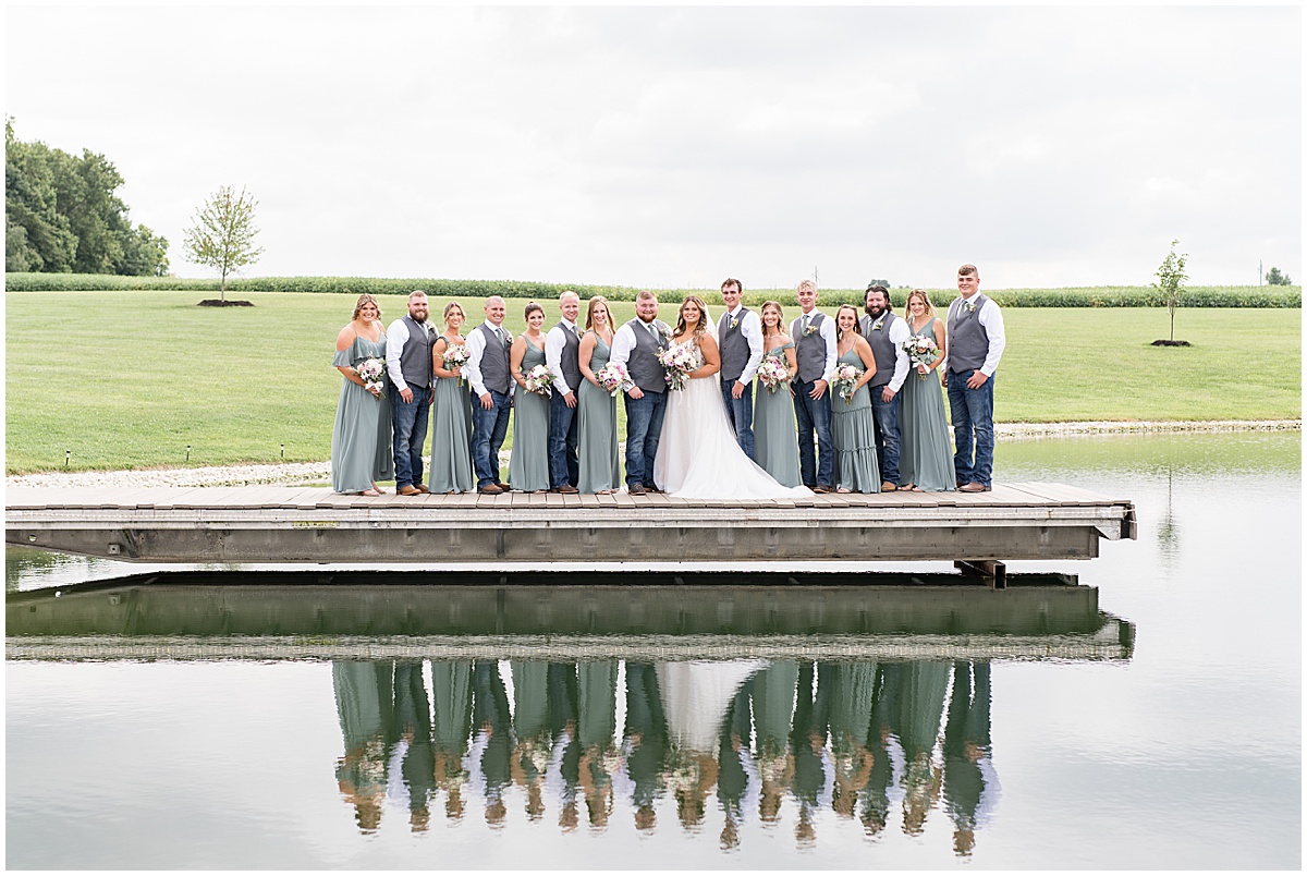 Full bridal party on dock at private property wedding in Peru, Indiana
