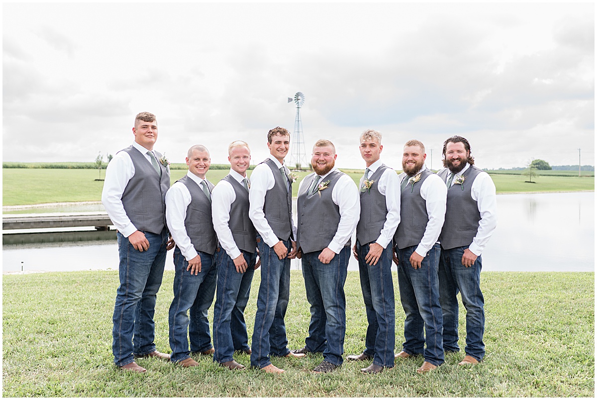 Groom with groomsmen by pond at private property wedding in Peru, Indiana